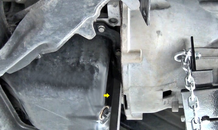 Wedging Engine Transmission Apart Using Pry Bar