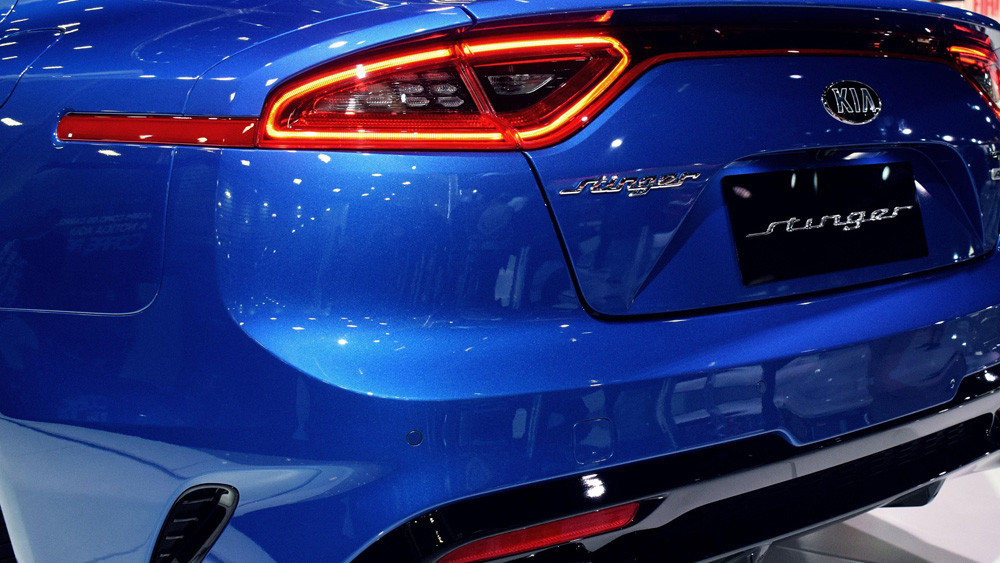 trunk of blue kia stinger vehicle