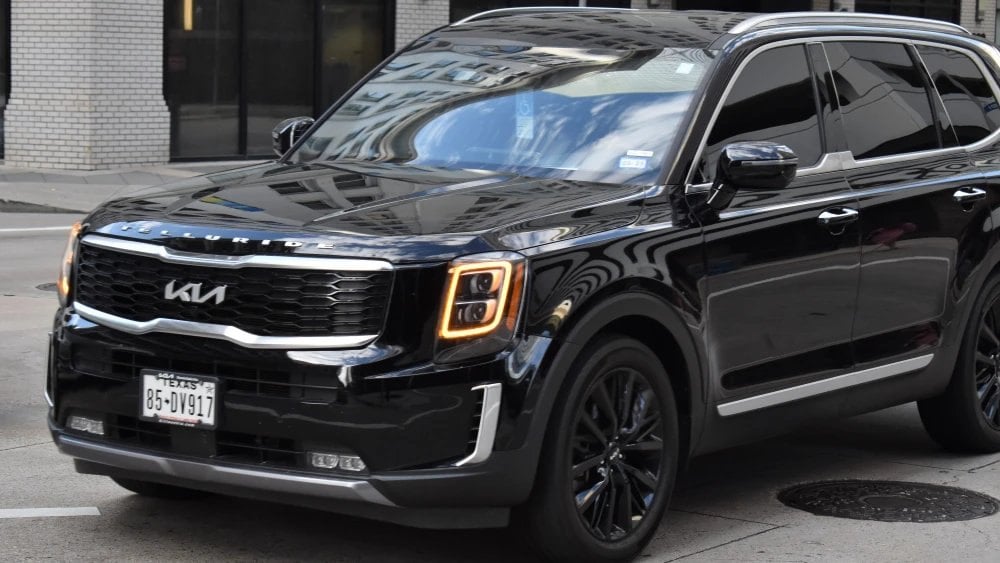 Houston, TX USA 10-4-2024 - A black metallic colored Kia Telluride Prestige cruising in the downtown financial district of Houston.