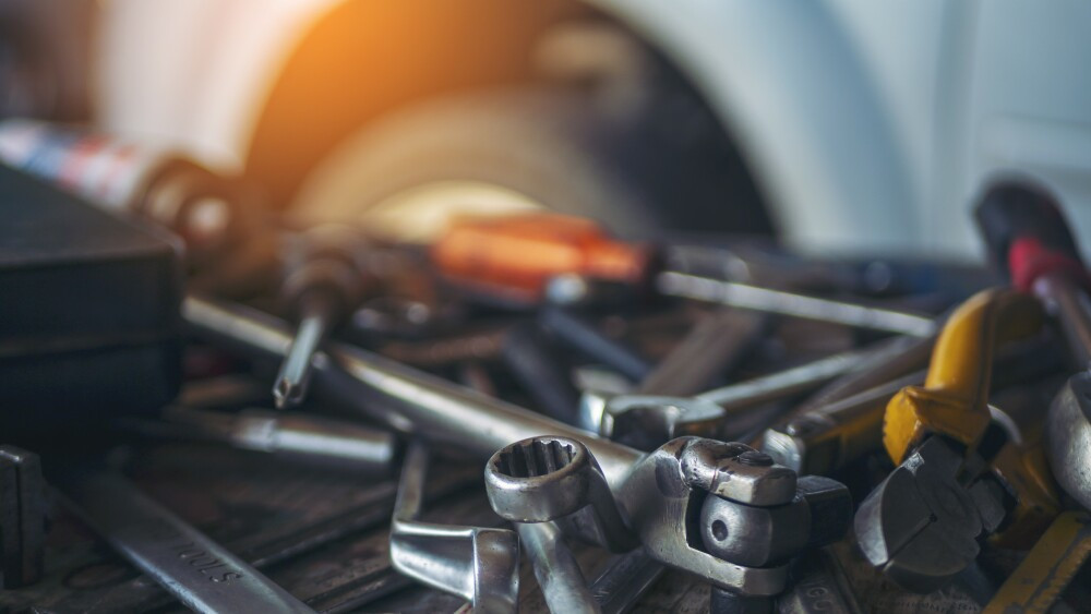 Mechanic tools engineering equipment car auto repair shop with copy space. Blurred background mechanical service. Heavy screw grungy rusted wrenches dirty screwdriver object. Industrial hardware set