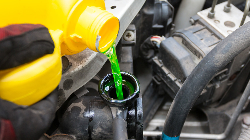 pouring engine coolant