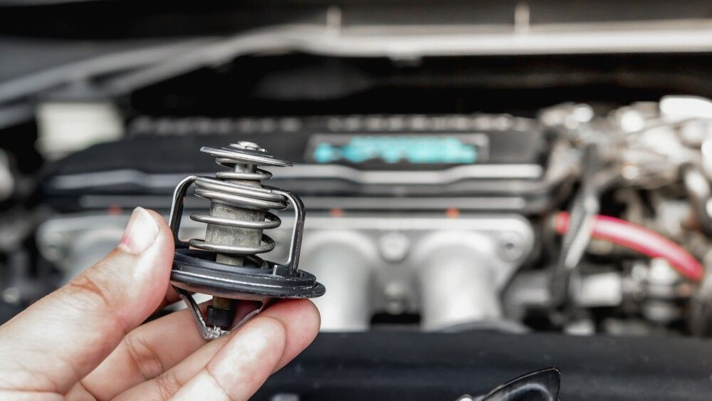 Close up Car thermostat for maintenance in engine room and tool for service