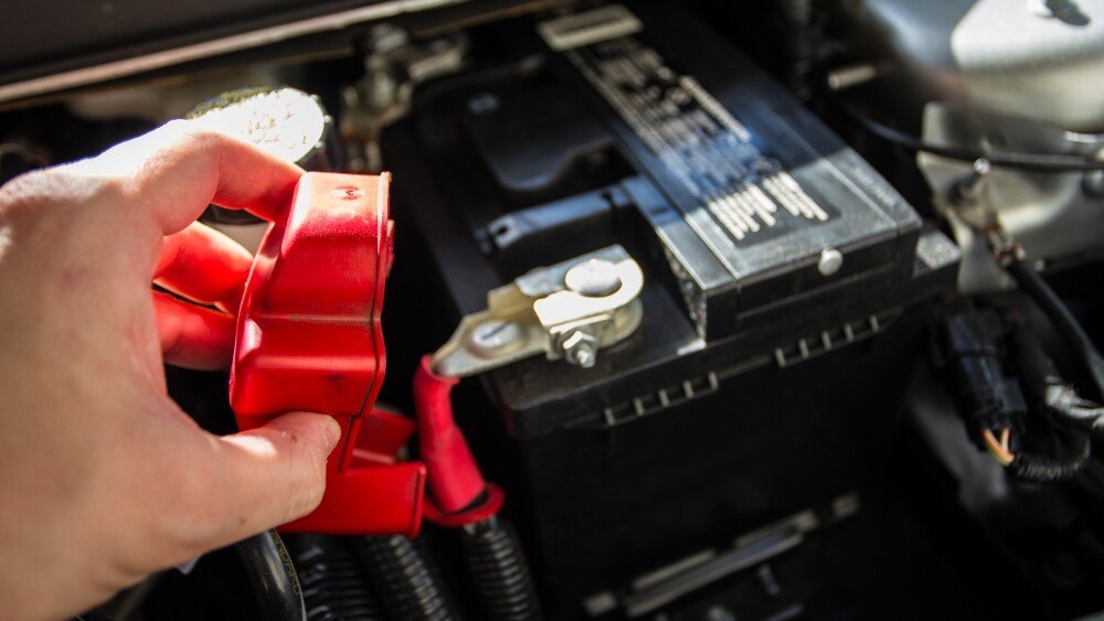 Mechanic checking car battery