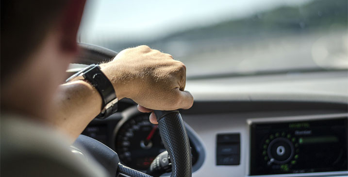 Driver Behind Steering Wheel