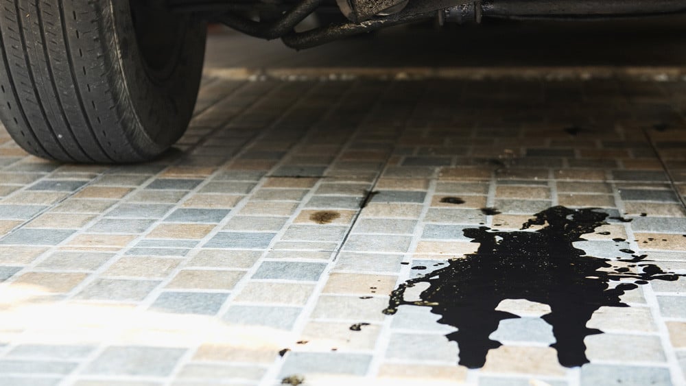 oil leak puddle under car