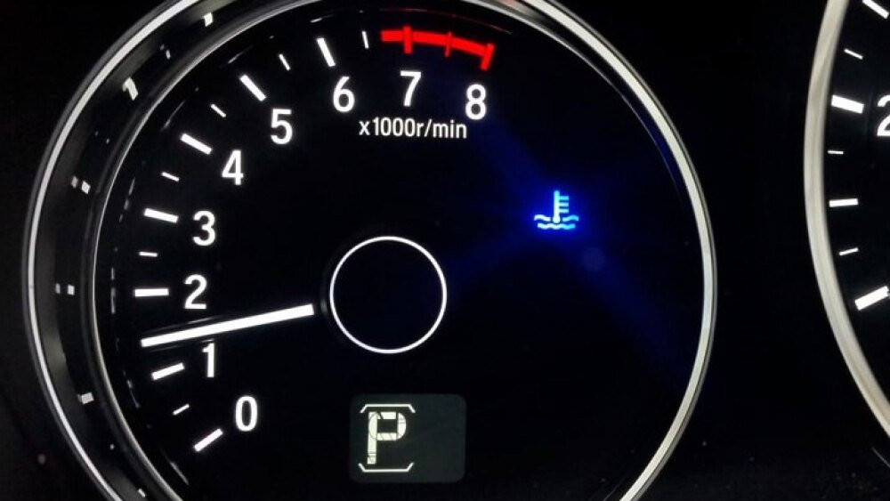 Blue water temp light illuminated because a thermostat is stuck open