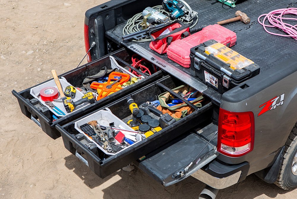 Man accessing a DECKED Drawer System tool storage drawer