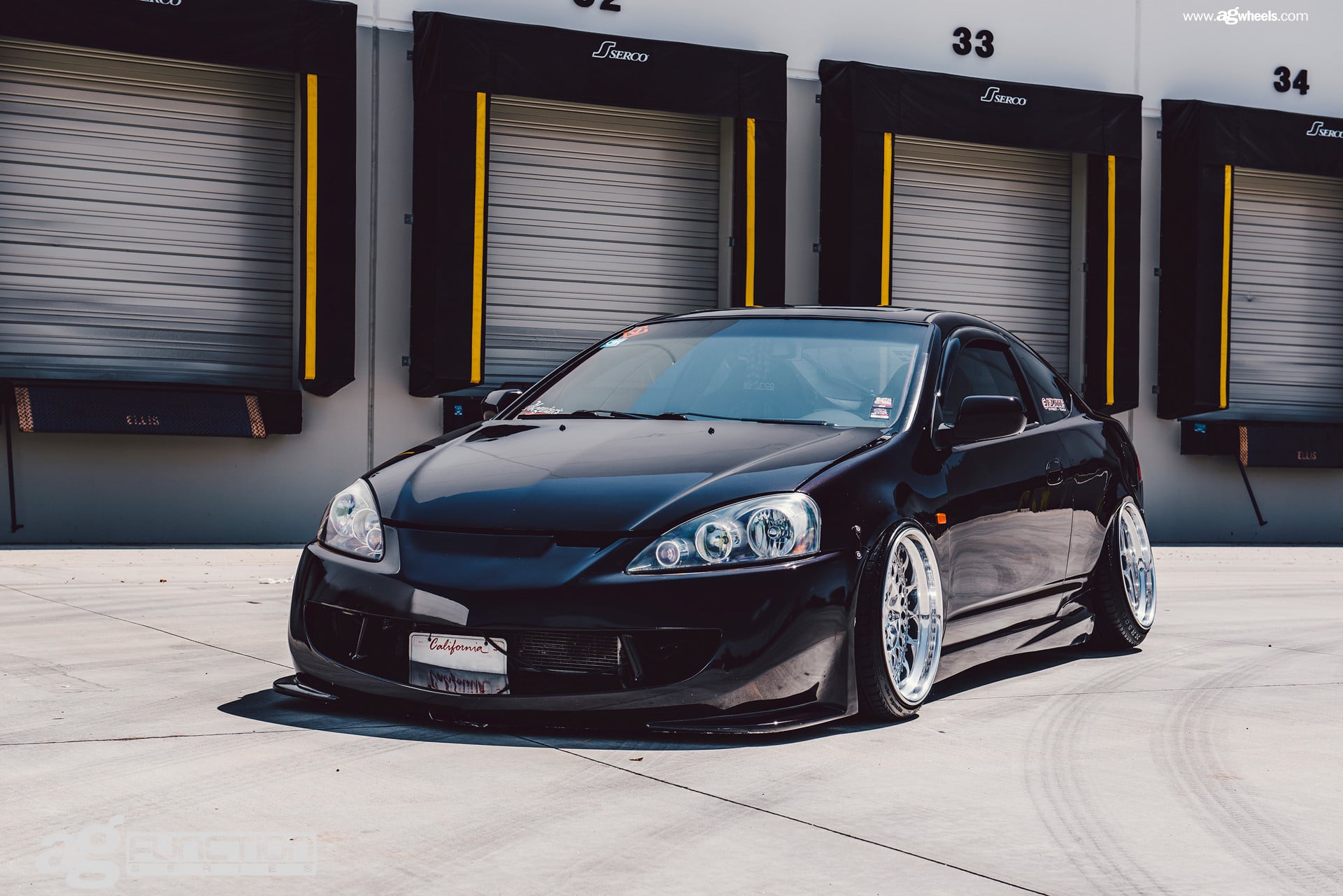 Carbon Fiber Bumper Lips on Black Acura RSX - Photo by Avant Garde Wheels