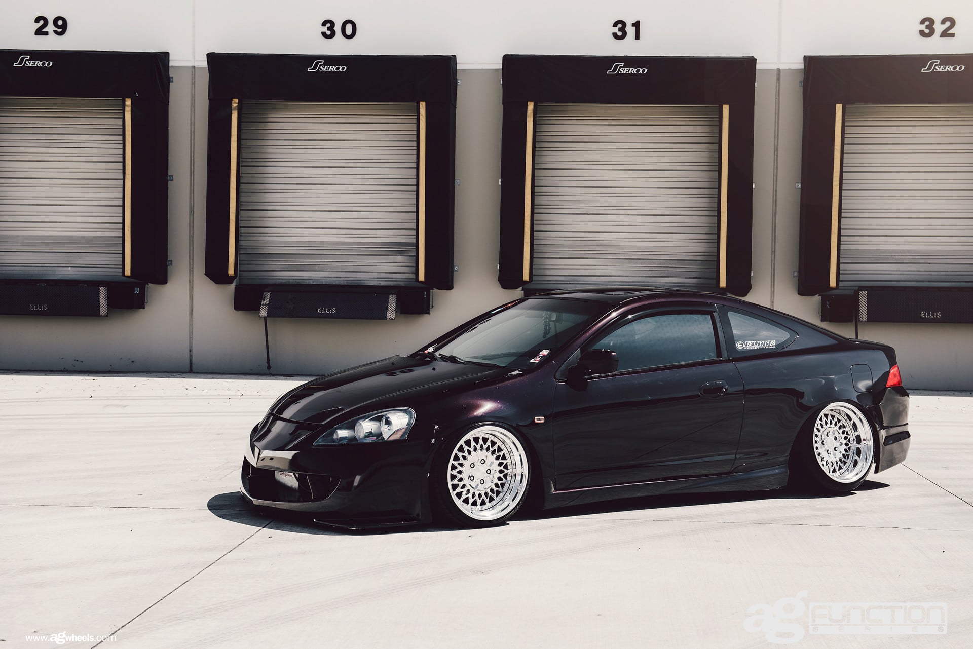 Custom Projector Headlights on Black Acura RSX - Photo by Avant Garde Wheels