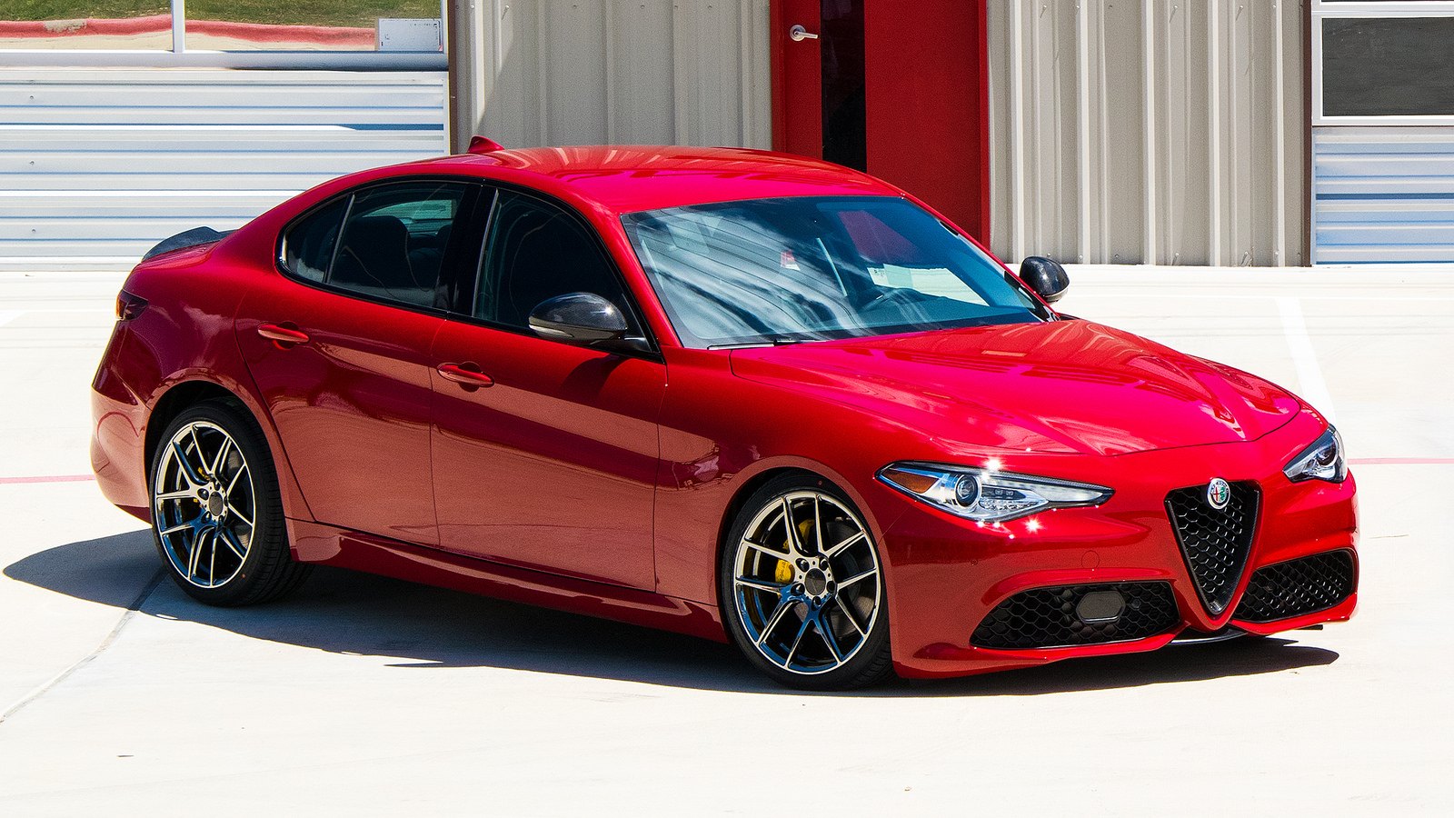 Exotic Italian Elegance of Red Alfa Romeo Guilia Accentuated by
