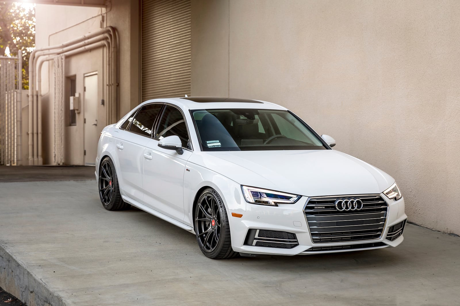 White Audi A4 Quattro with Custom Headlights - Photo by Vorstiner