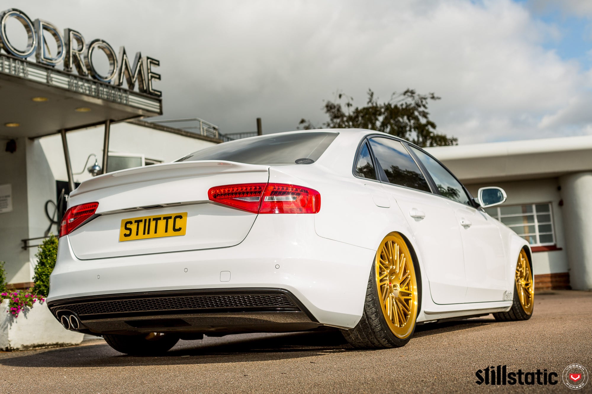 White Audi A4 with Custom Rear Bumper Cover - Photo by Vossen