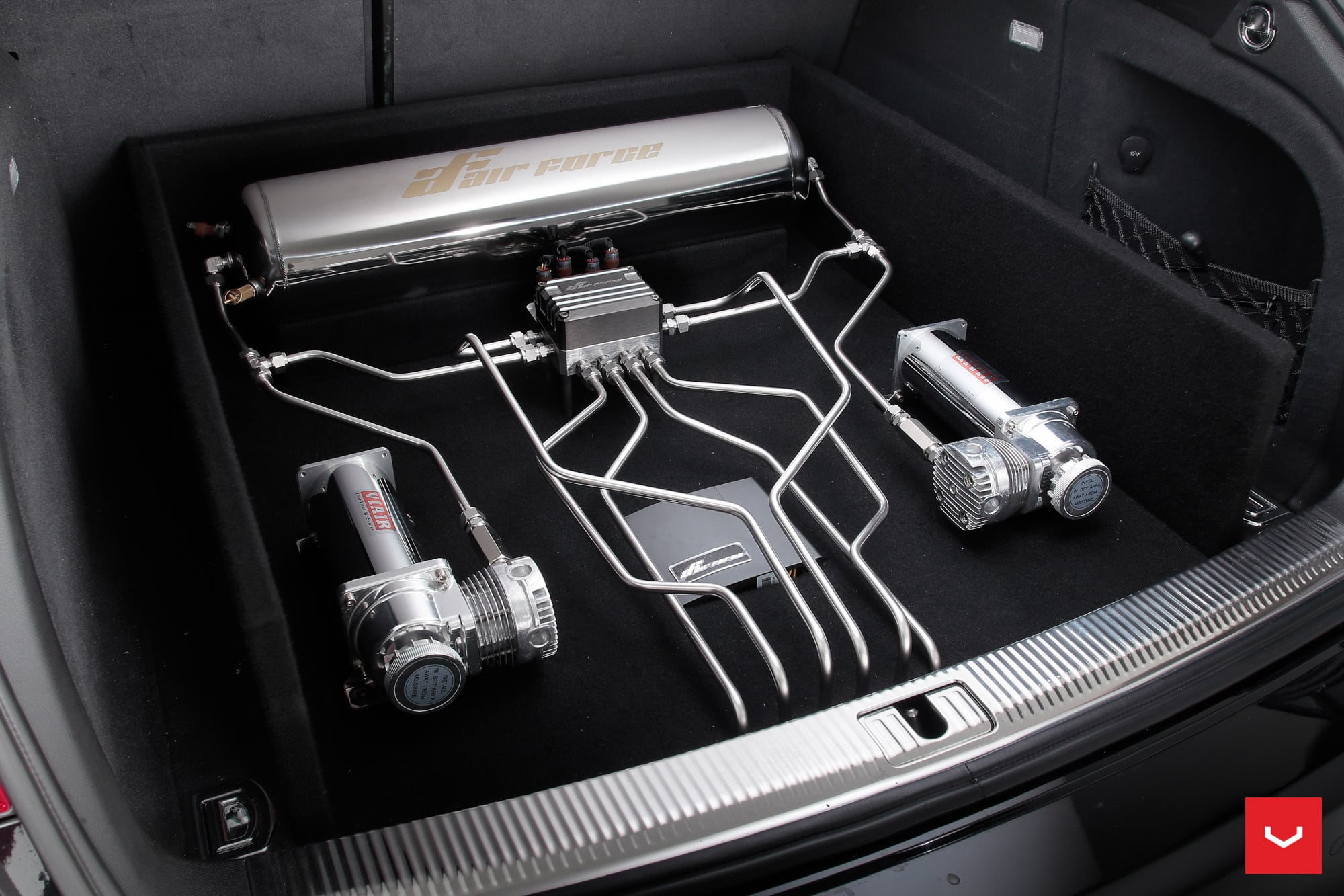 Audi A4 with Air Force Suspension Unit in the Cargo Area - Photo by Vossen