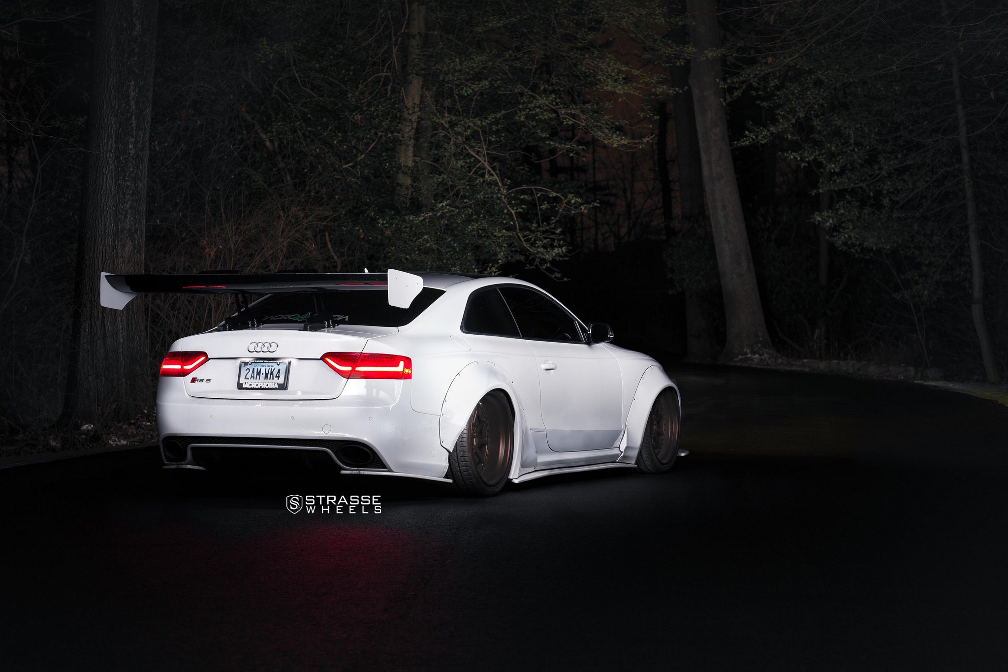 White Audi S5 Gains a Racer Look with Huge Spoiler and Wide Body Kit.