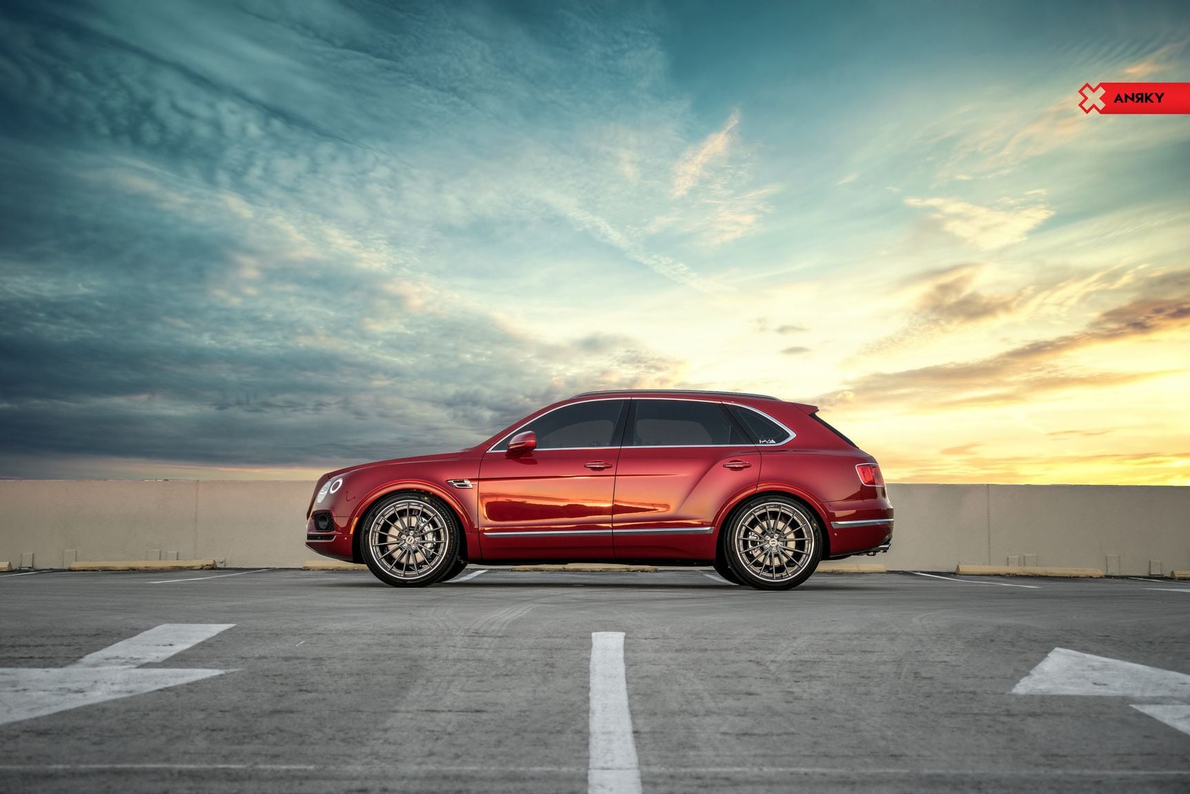 Red Bentley Bentayga with Aftermarket Side Skirts - Photo by Anrky Wheels