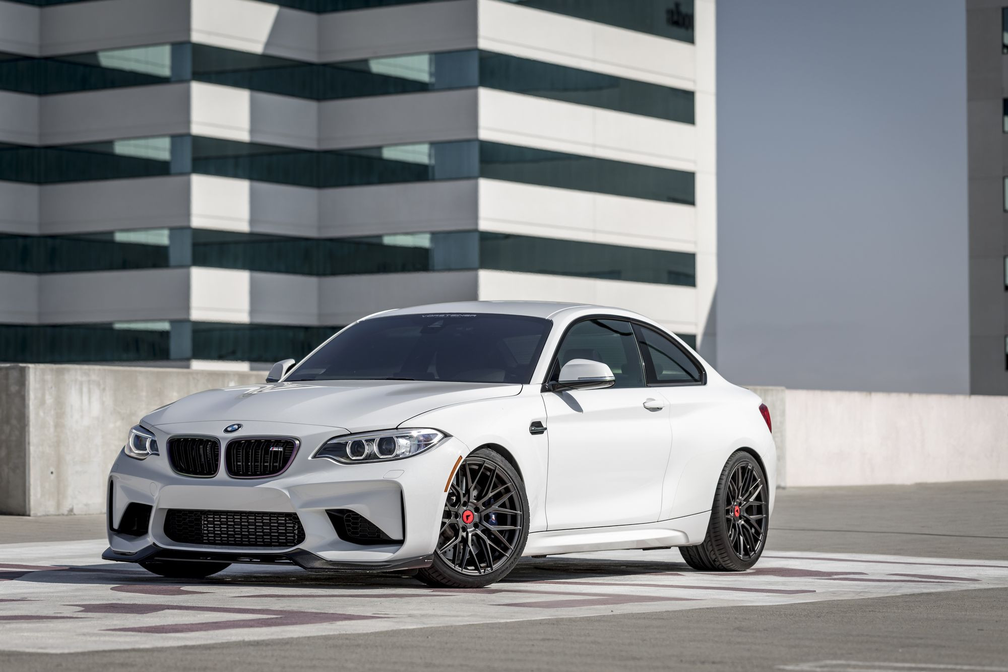 White BMW 2-Series with Crystal Clear Halo Headlights - Photo by Vorstiner