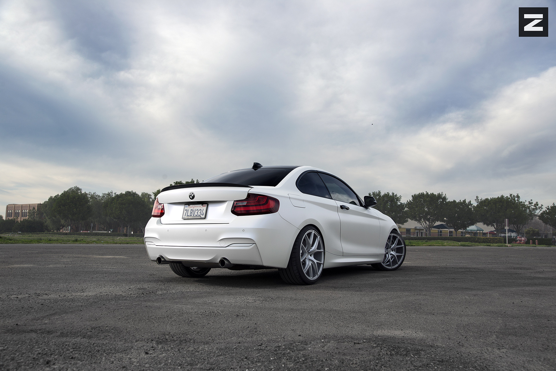 White BMW 2-Series with Rear Lip Spoiler - Photo by Zito Wheels