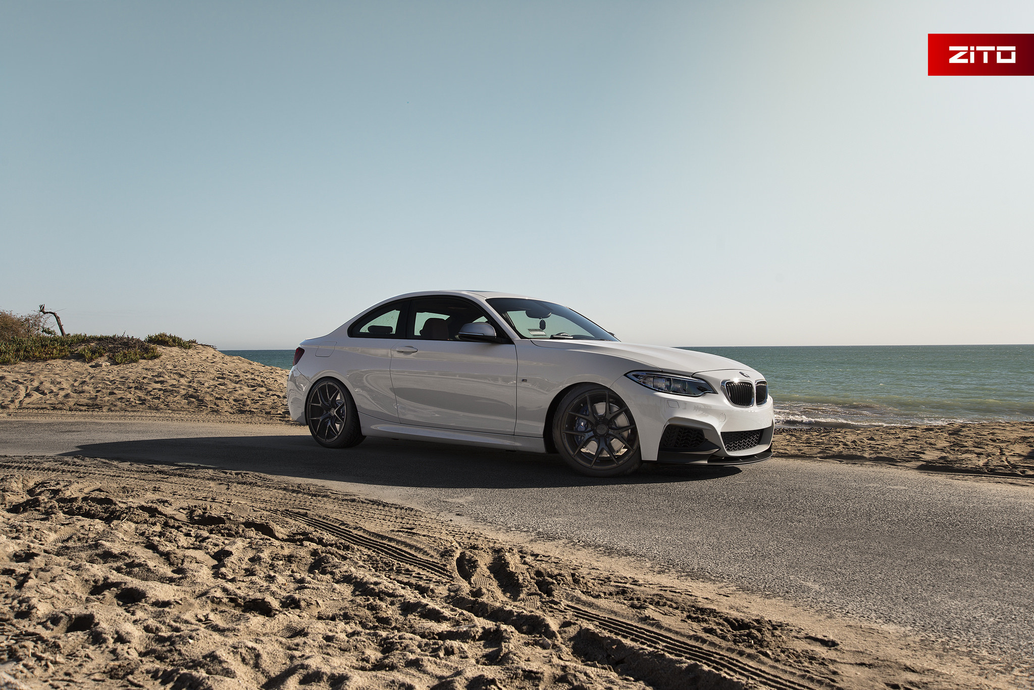 Aftermarket Side Skirts on White BMW 2-Series - Photo by Zito Wheels