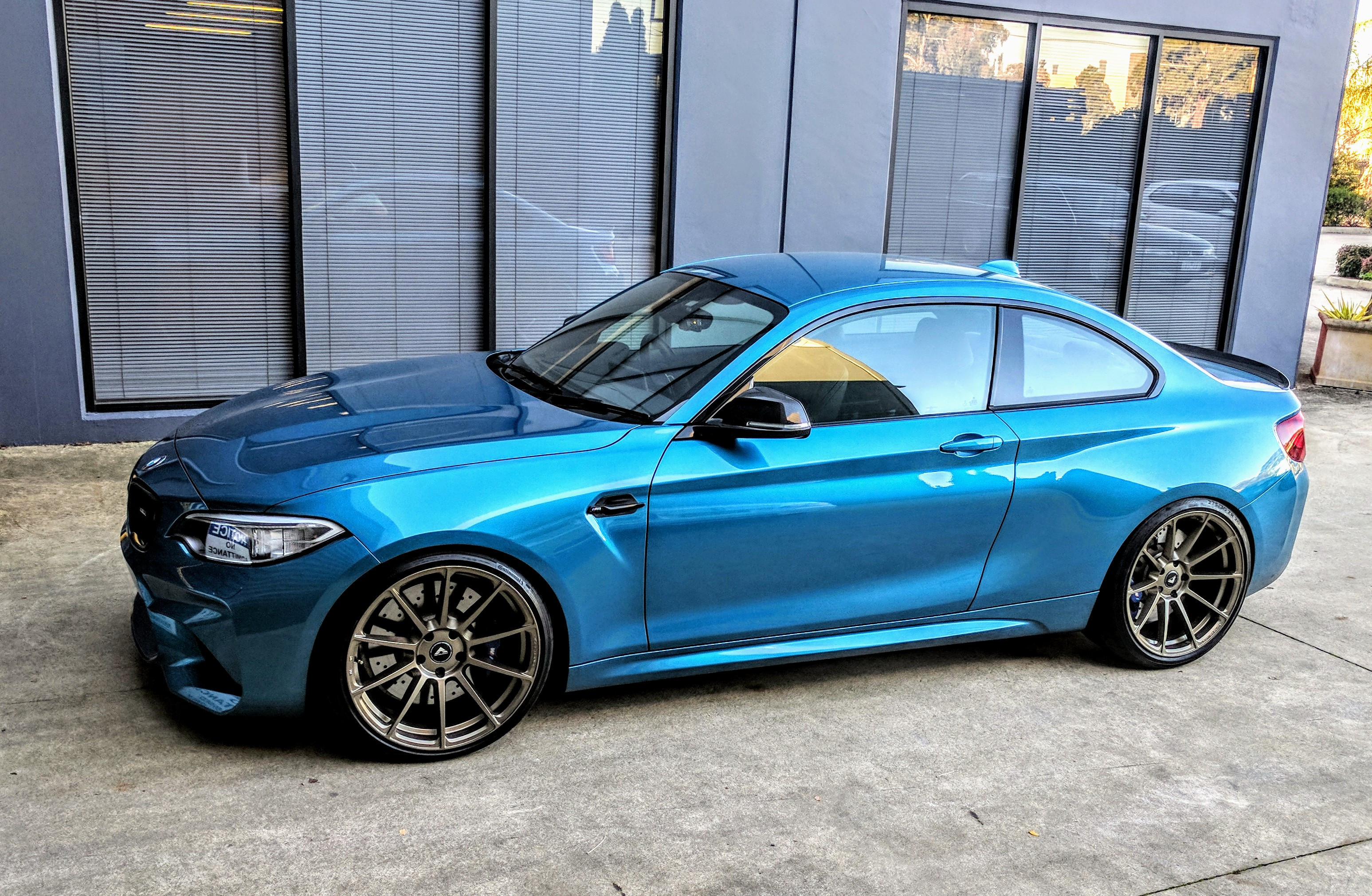 Aftermarket Projector Headlights on Blue BMW 2-Series - Photo by Vorstiner