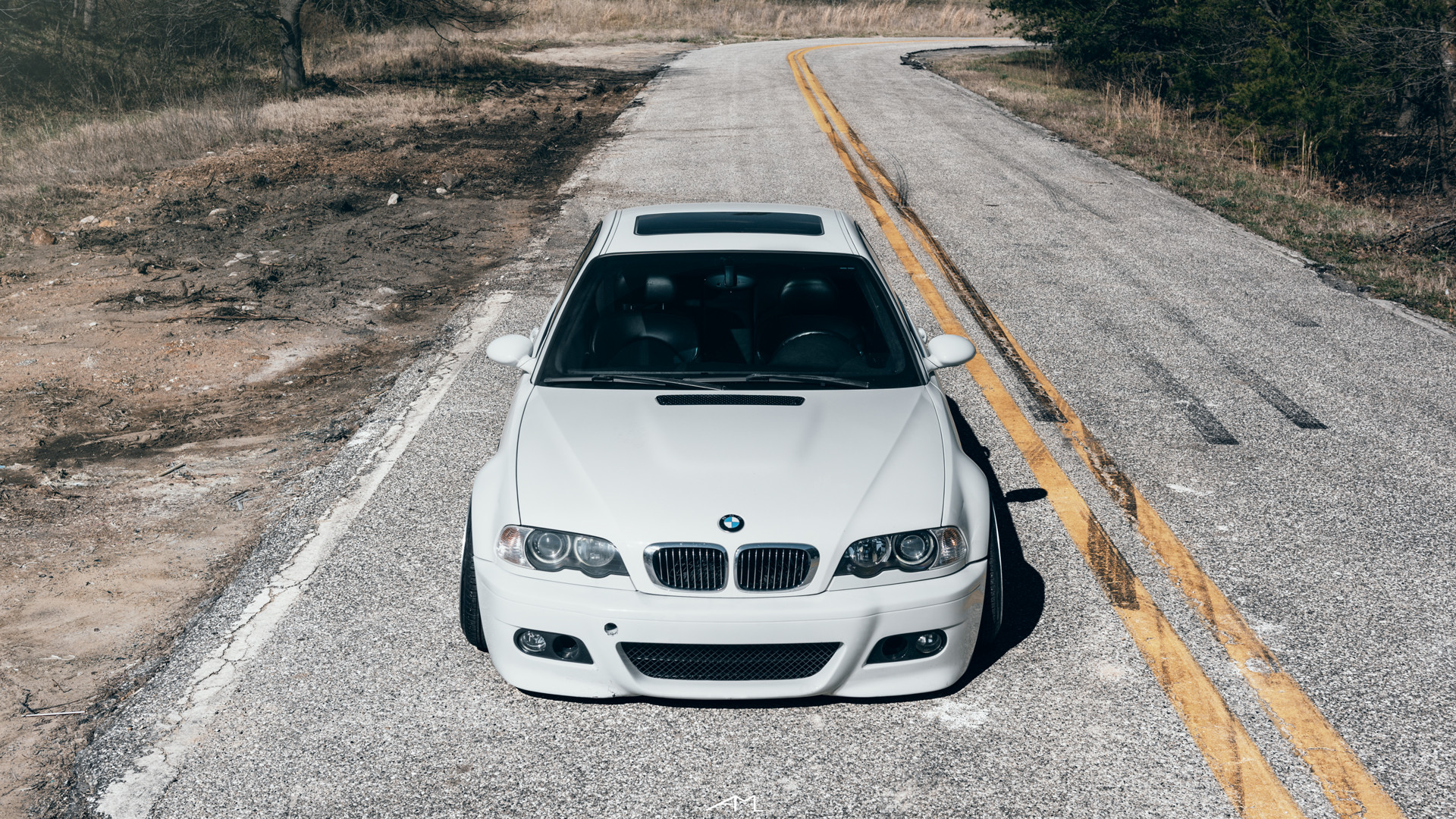 Aftermarket Halo Headlights on White BMW 3-Series - Photo by Arlen Liverman