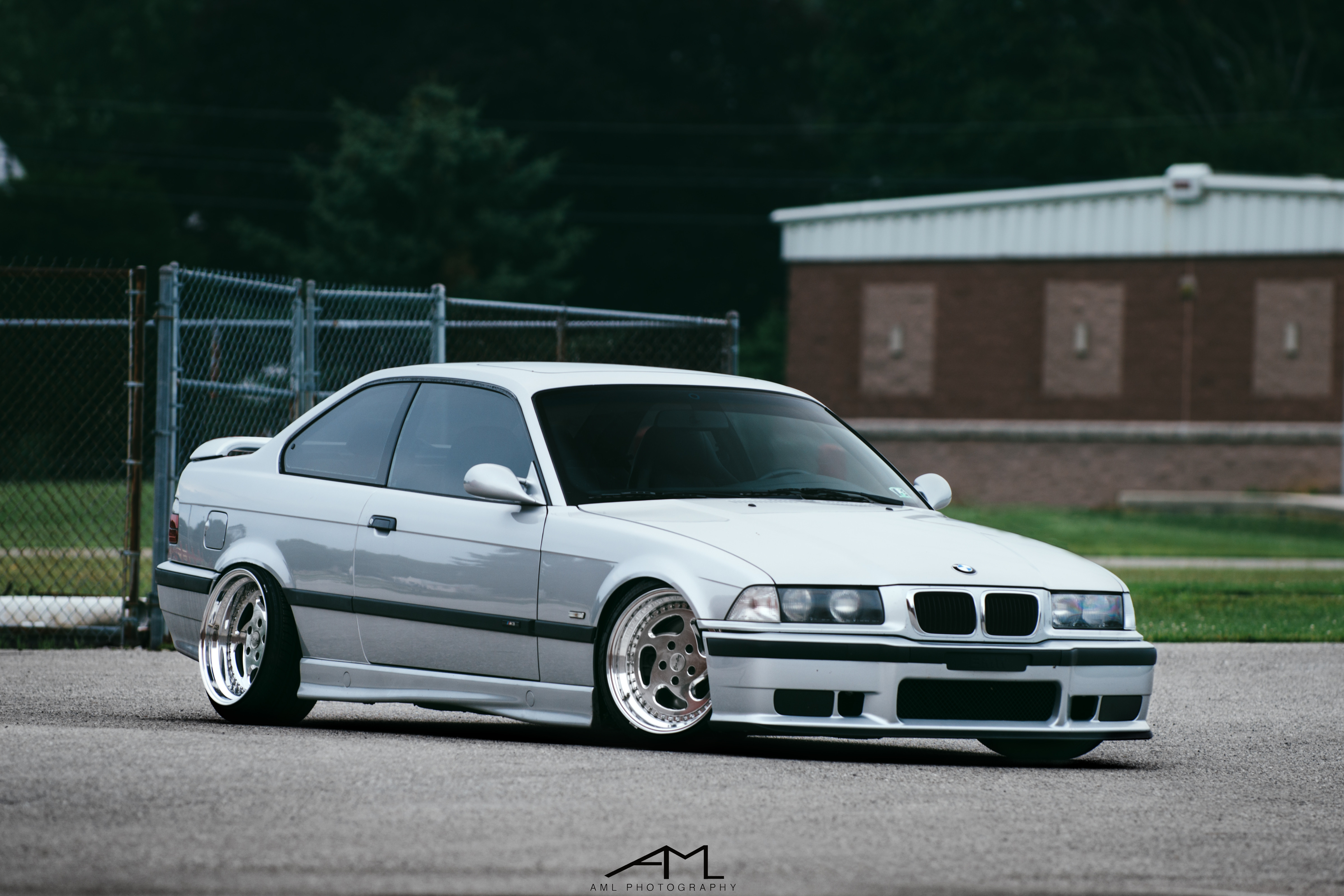 White BMW 3-Series with Aftermarket Side Skirts - Photo by Arlen Liverman