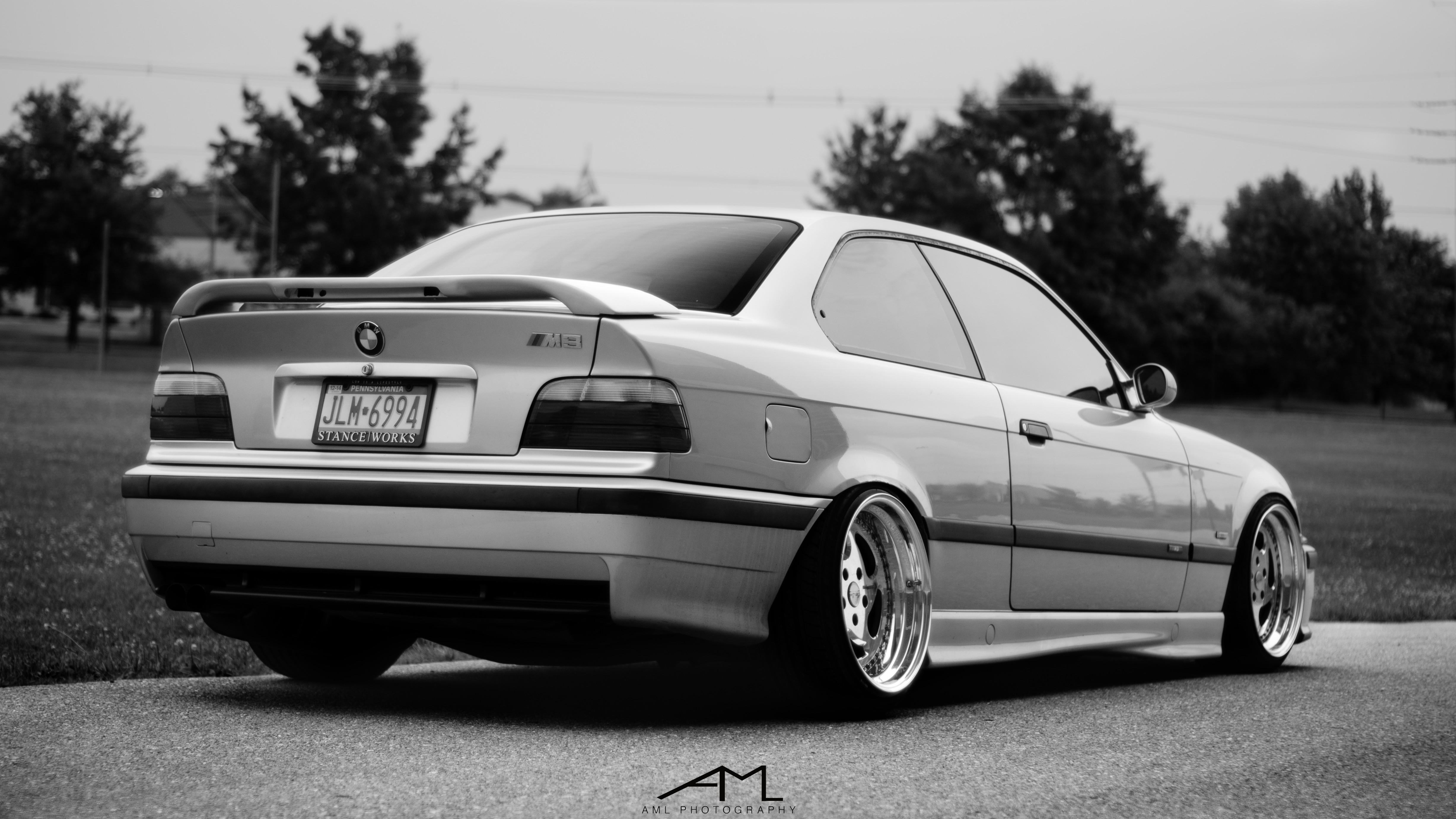 Aftermarket Rear Spoiler on White BMW 3-Series - Photo by Arlen Liverman