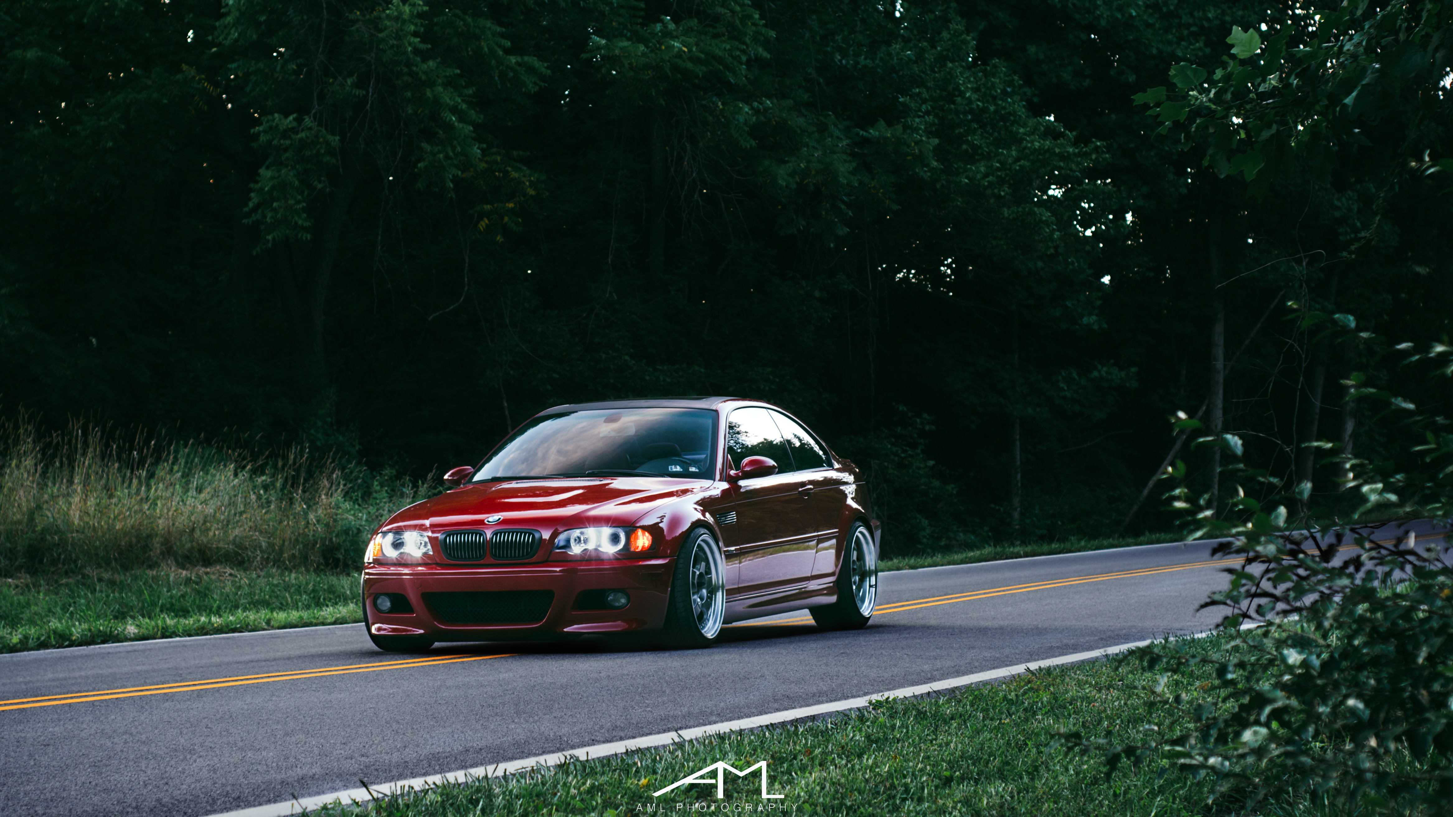 Red BMW 3-Series with Blacked Out Grille - Photo by Arlen Liverman
