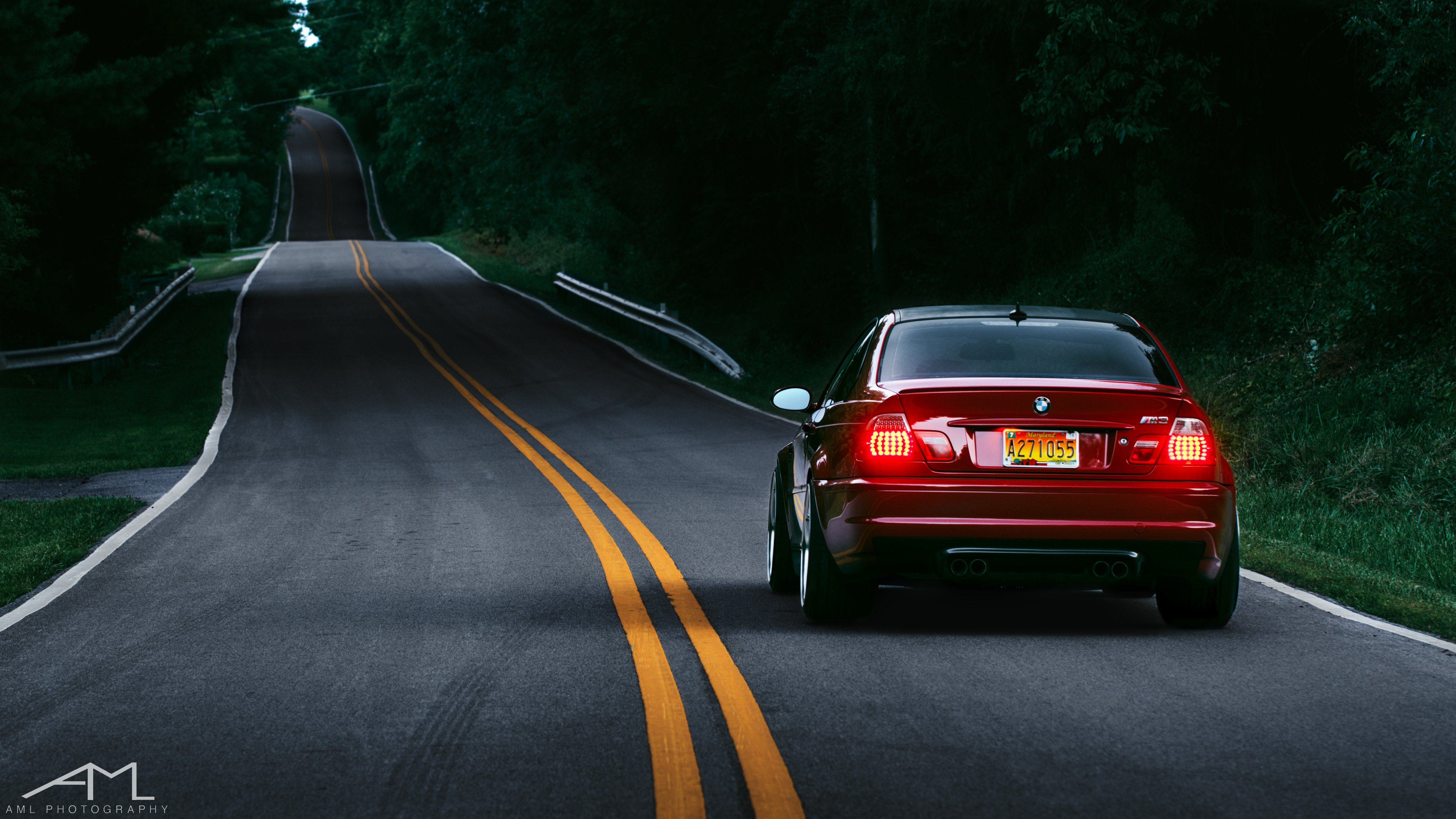 Red BMW 3-Series with Aftermarket Rear Diffuser - Photo by Arlen Liverman