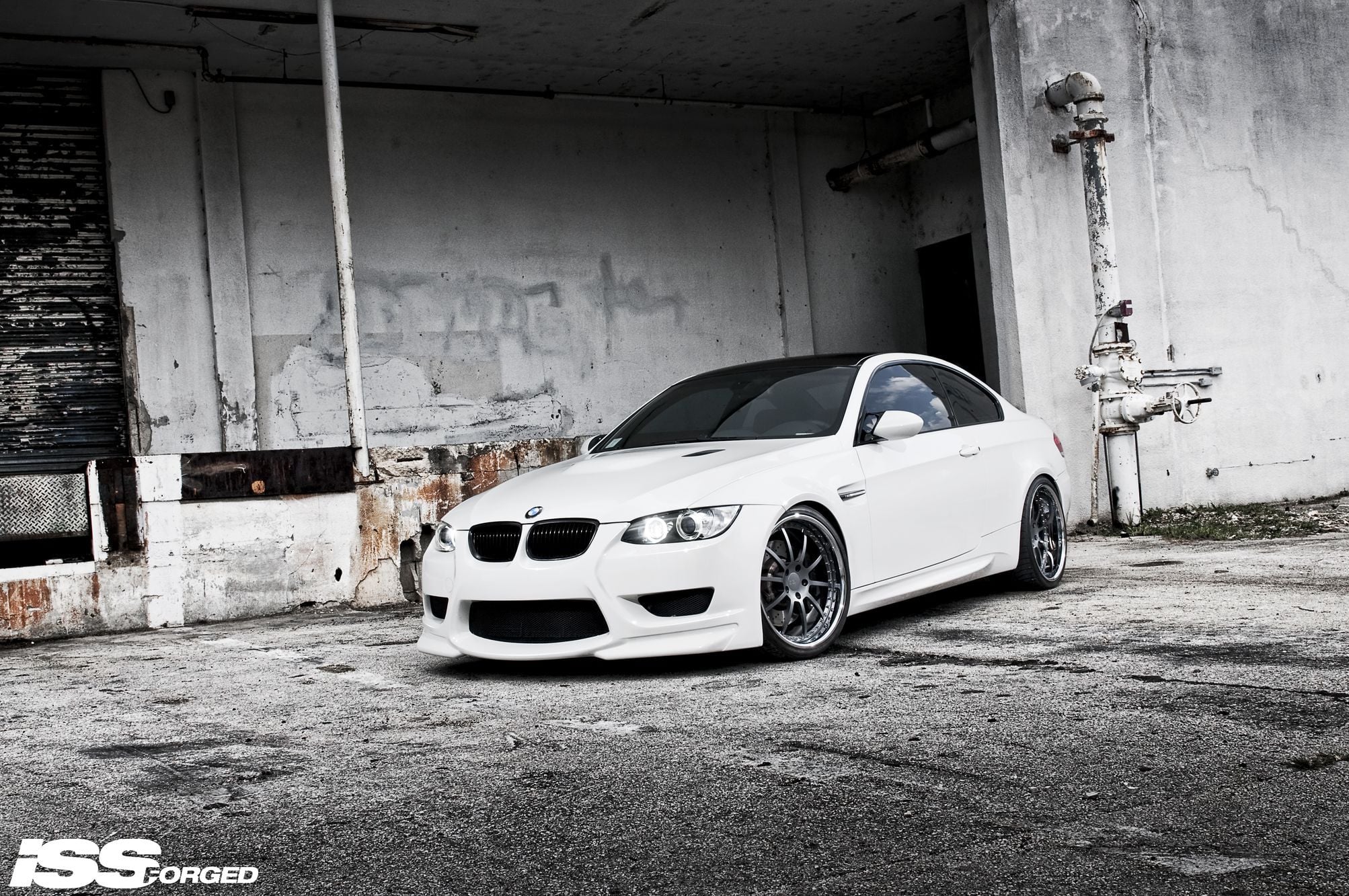 Aftermarket Front Bumper on White BMW 3-Series - Photo by William Stern