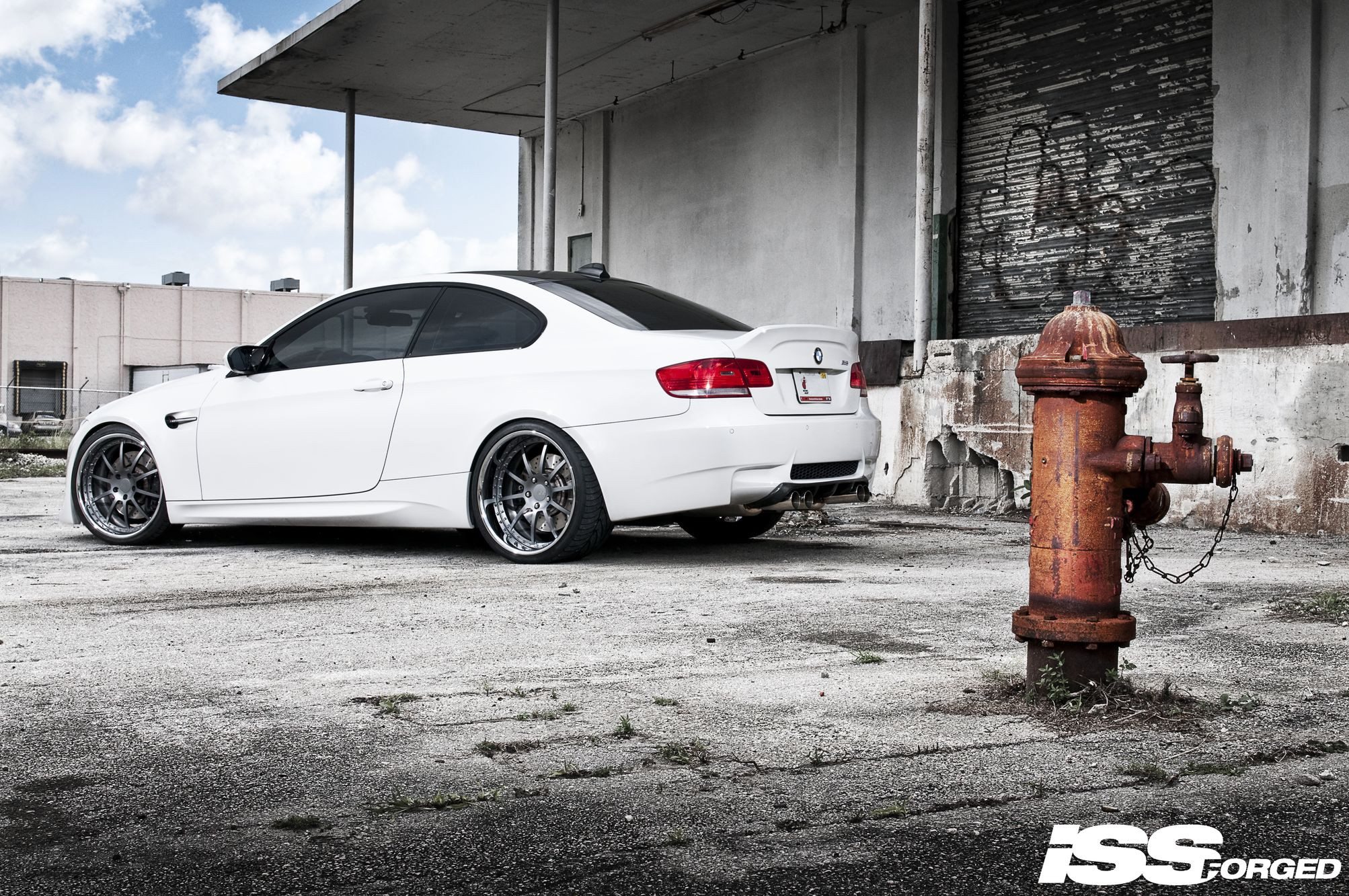 White BMW 3-Series with Aftermarket Rear Diffuser - Photo by William Stern