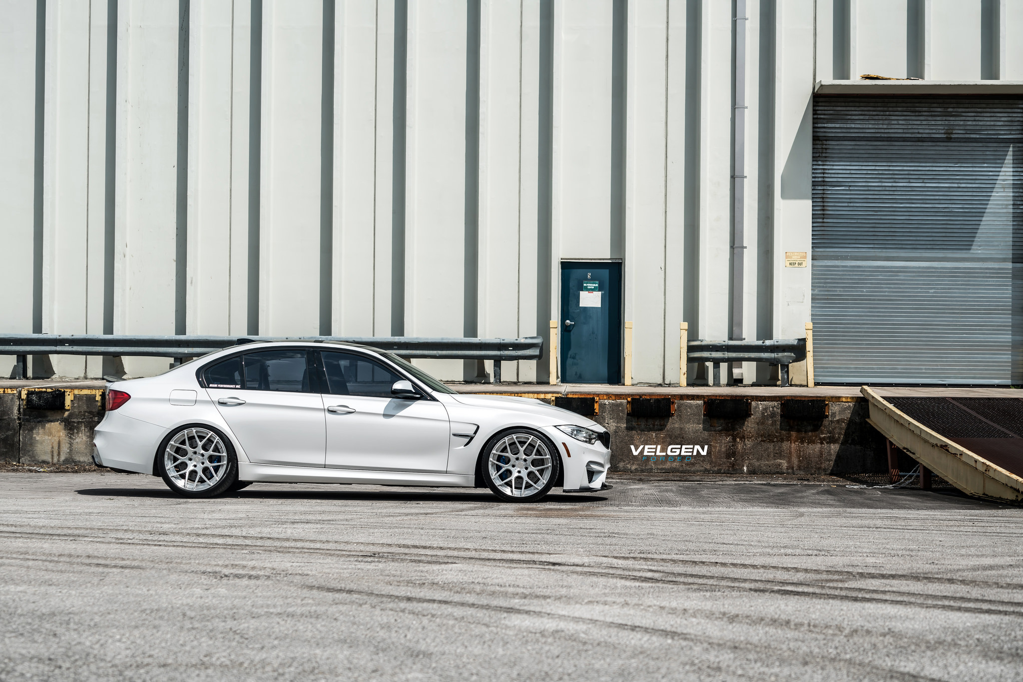 Aftermarket Side Skirts on White BMW 3-Series - Photo by Velgen