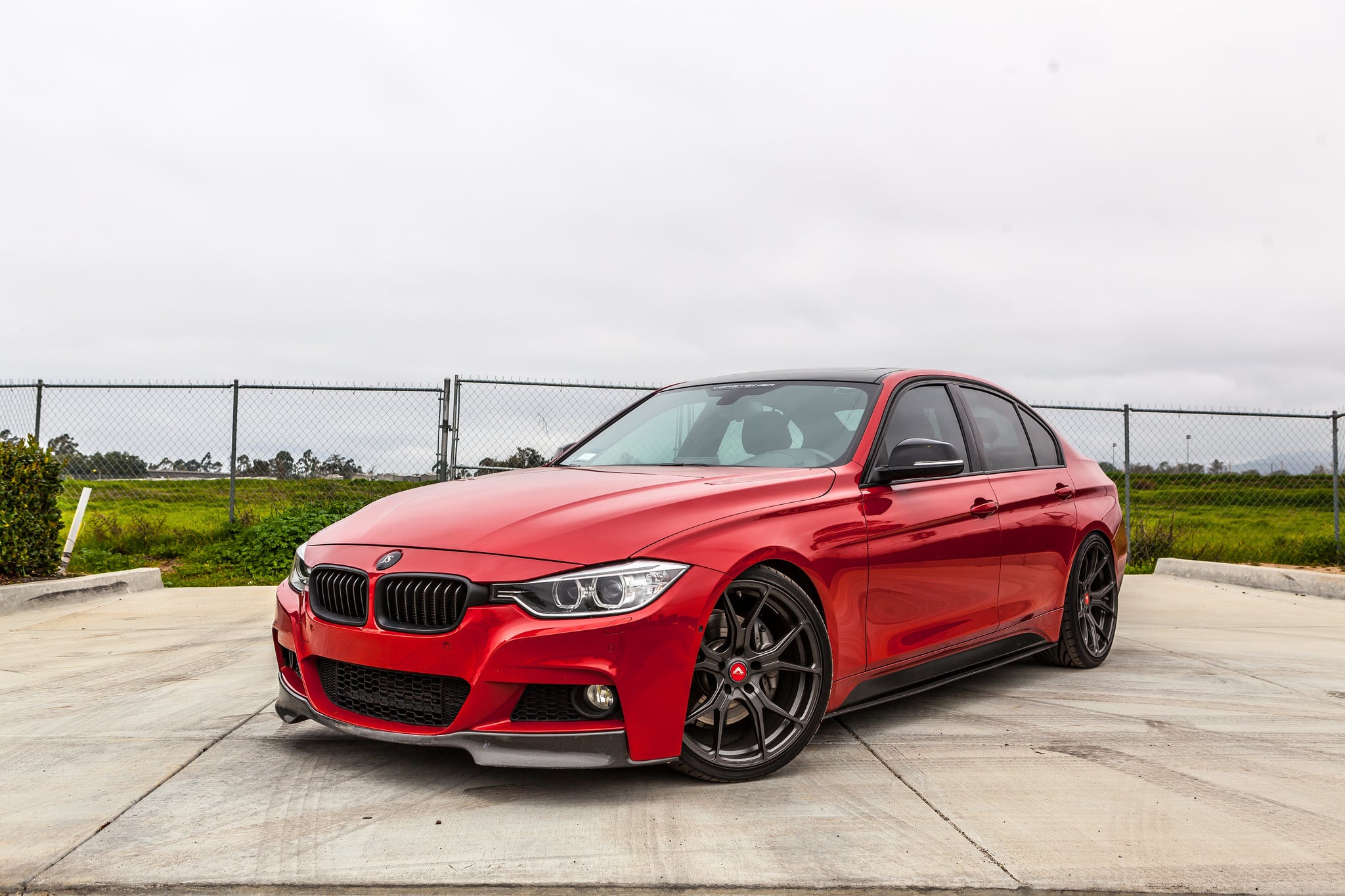 Custom Front Lip on Red BMW 3-Series - Photo by Vorsteiner