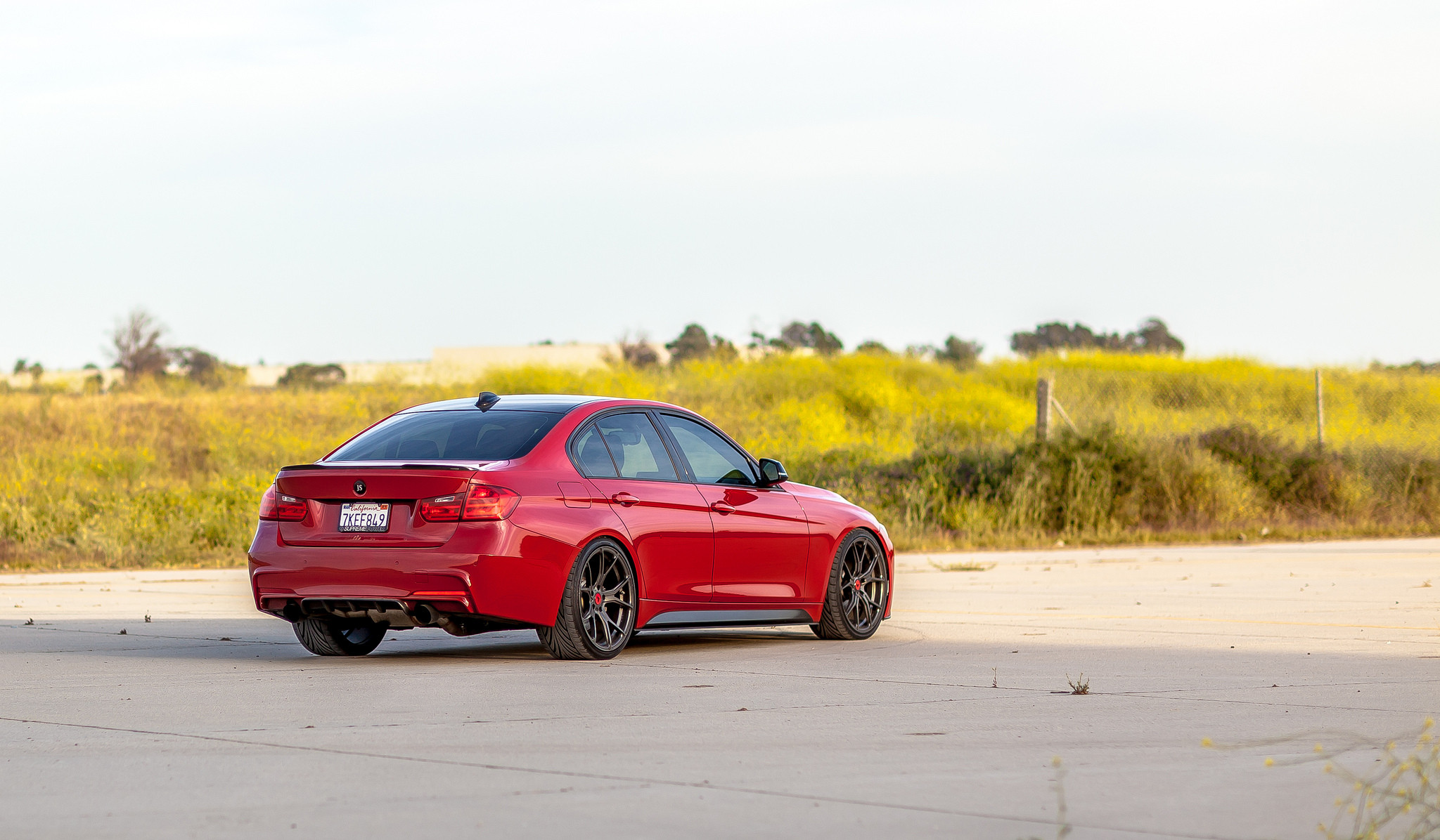 Red BMW 3-Series with Rear Lip Spoiler - Photo by Vorsteiner
