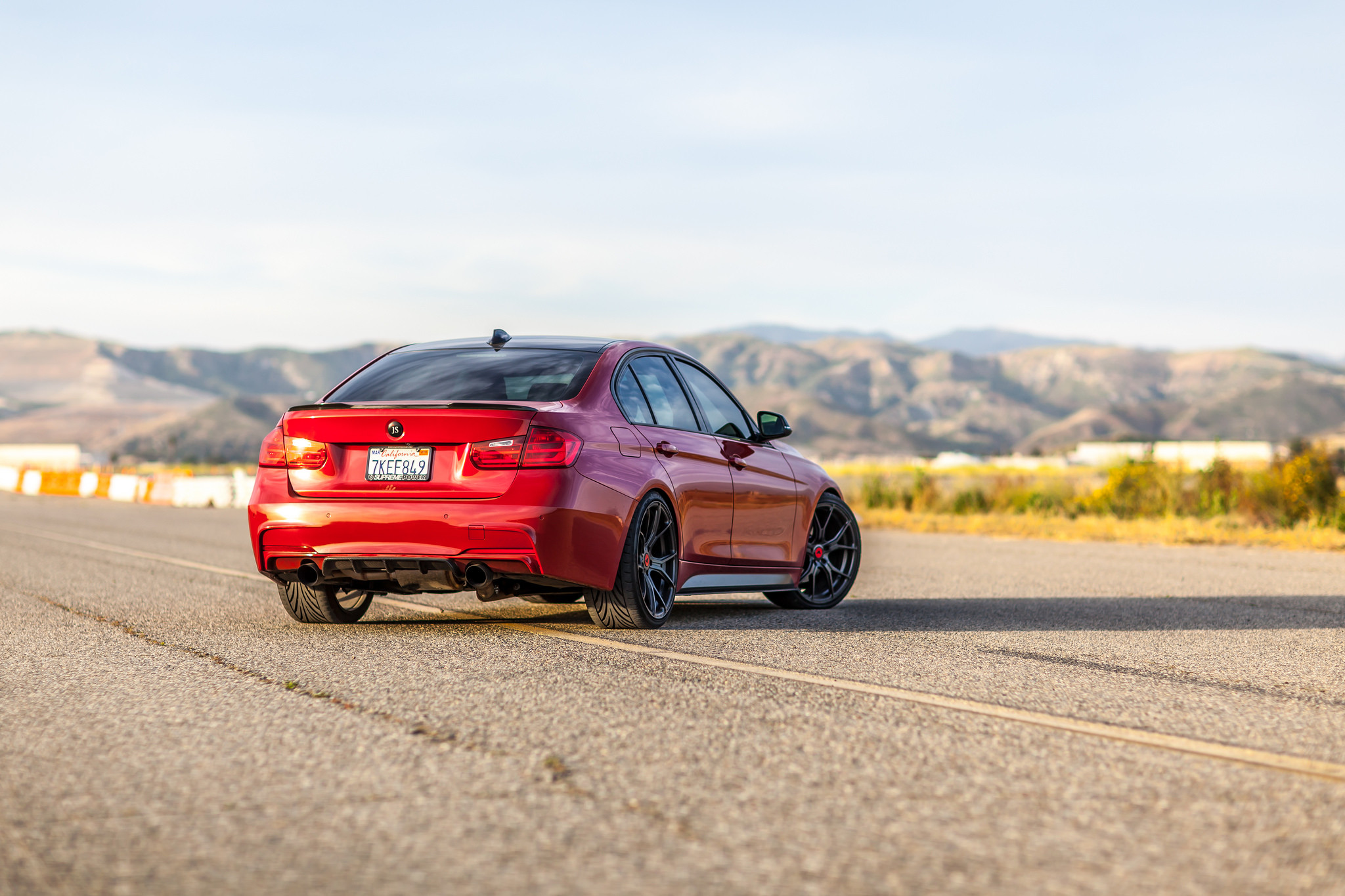 Aftermarket Rear Diffuser on Red BMW 3-Series  - Photo by Vorsteiner