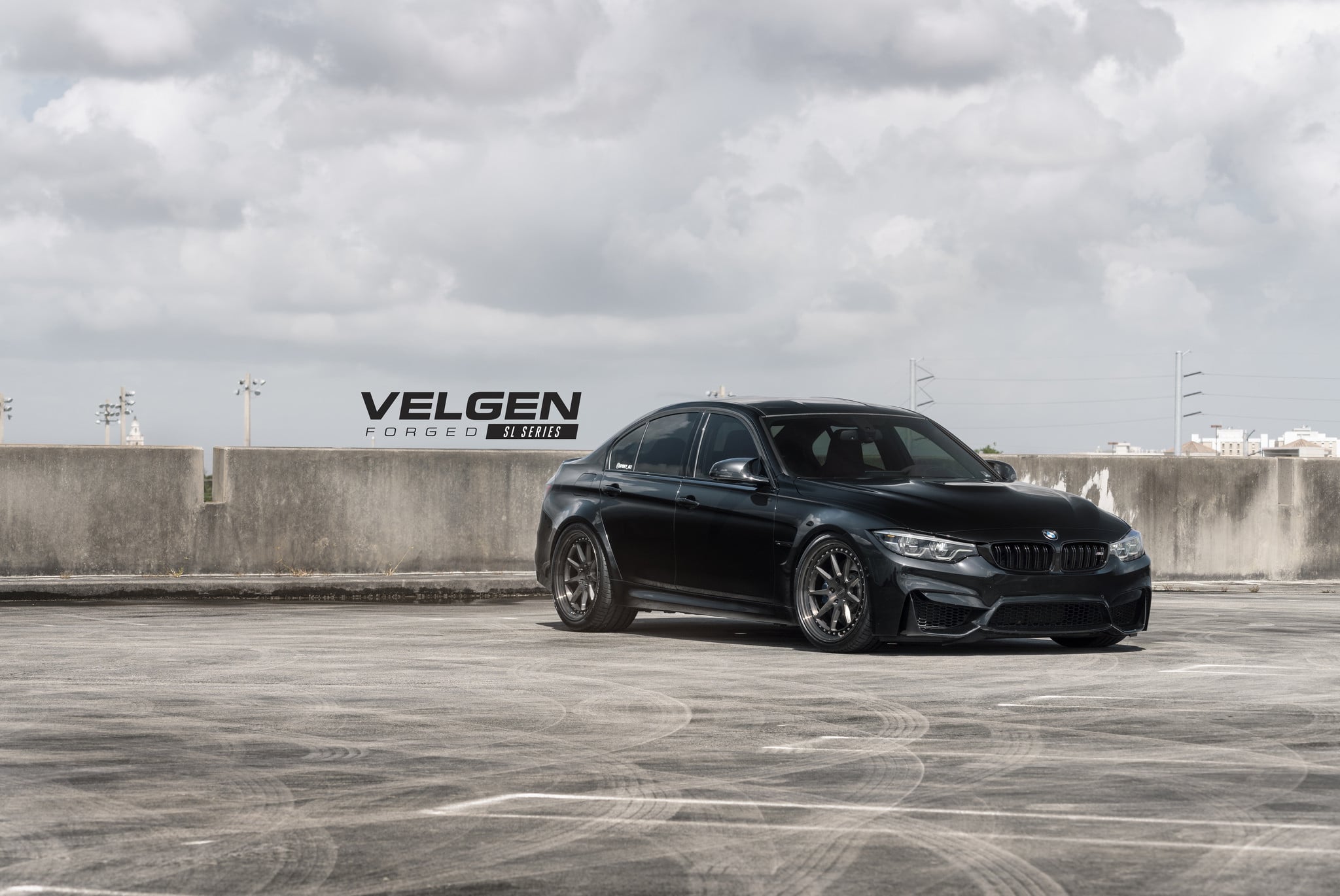 Aftermarket Side Skirts on Black BMW 3-Series - Photo by Velgen Wheels