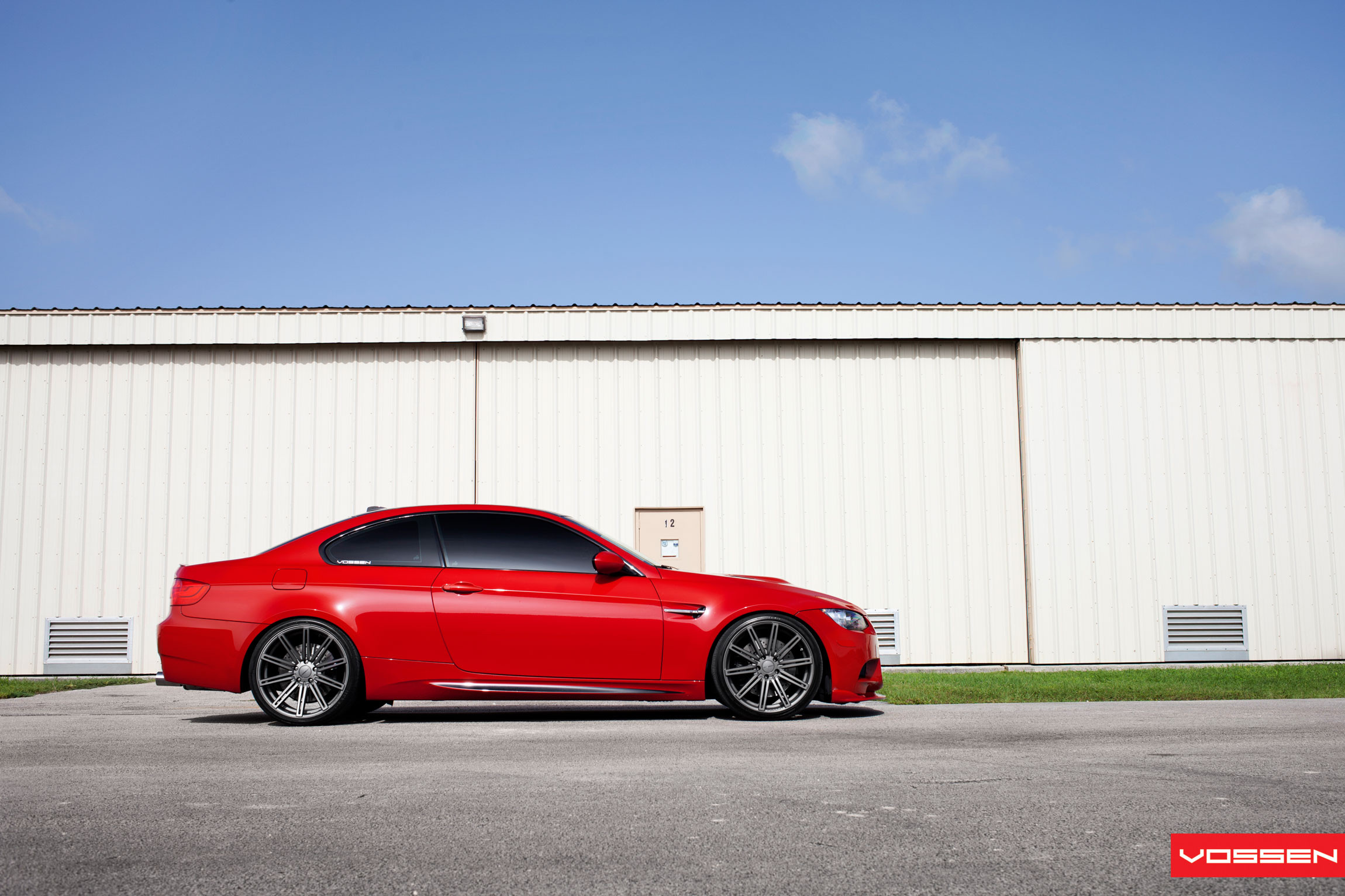 Gunmetal Vossen Wheels on Red BMW 3-Series - Photo by Vossen