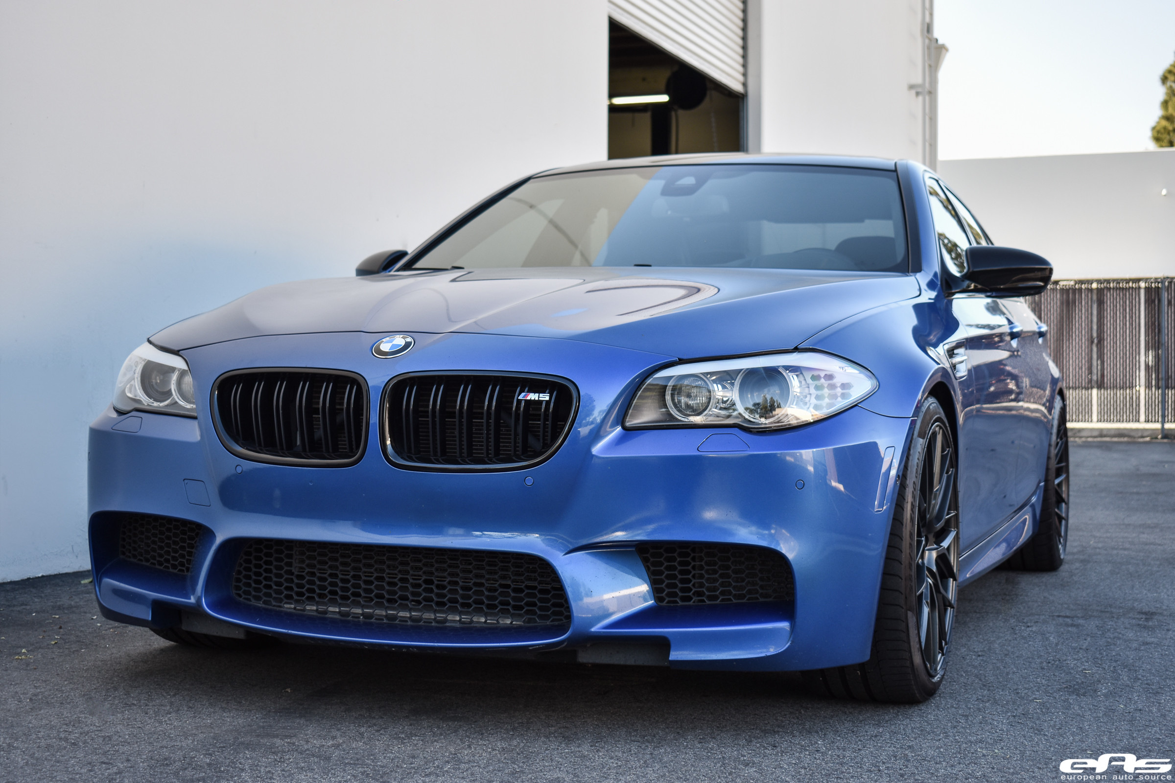 Blue BMW 5-Series with Aftermarket Halo Headlights - Photo by Vorstiner