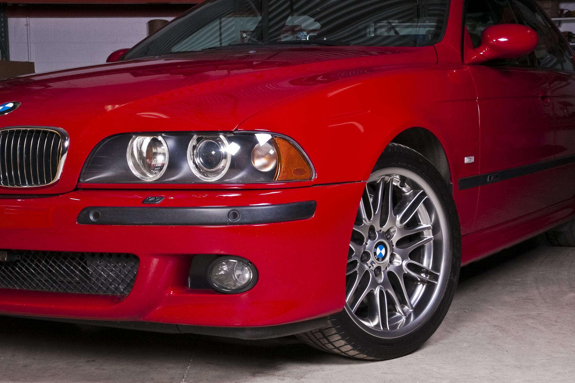 Aftermarket Halo Headlights on Red BMW 5-Series - Photo by dan kinzie
