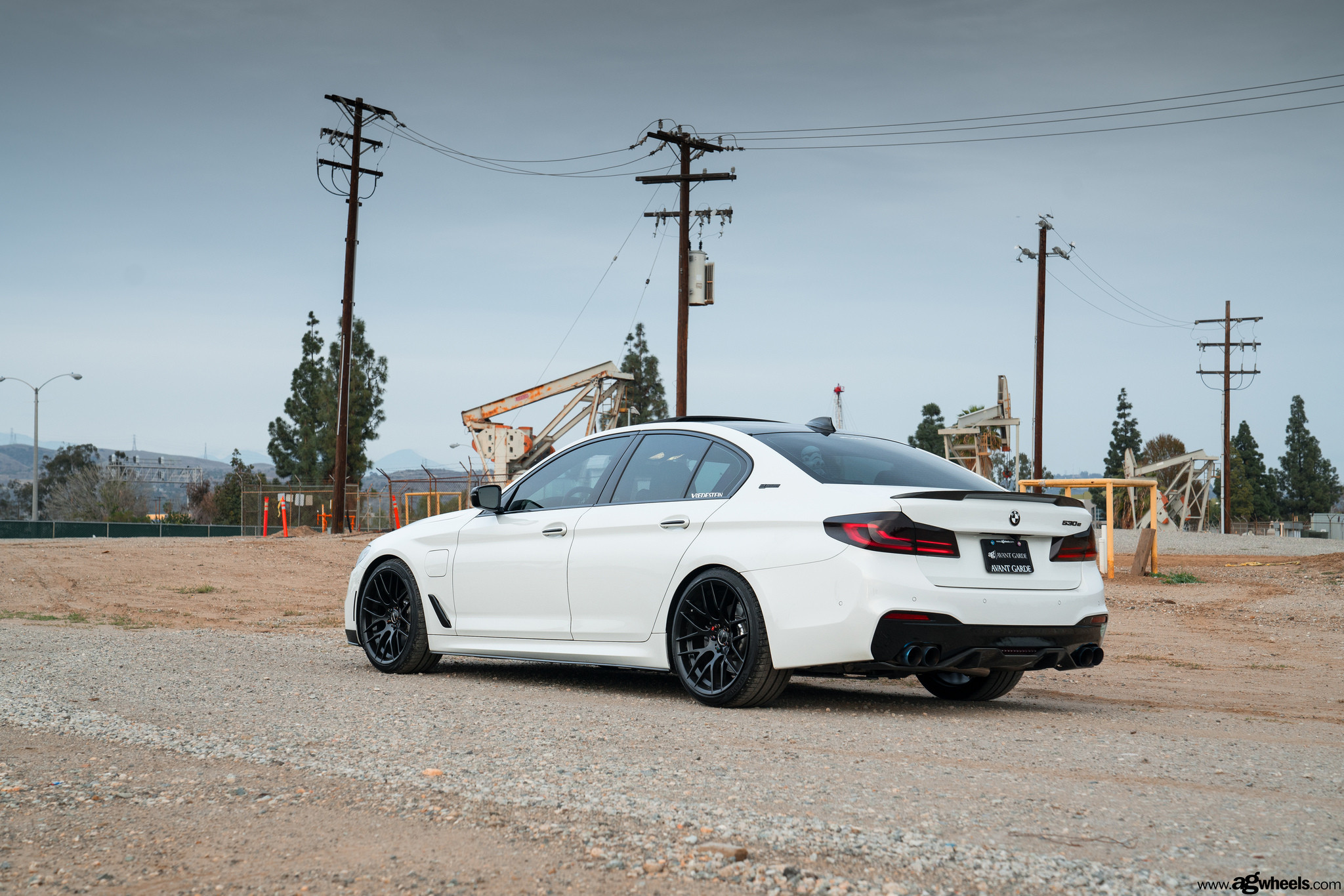 White BMW 5-Series with Red Smoke Taillights - Photo by Avant Garde Wheels