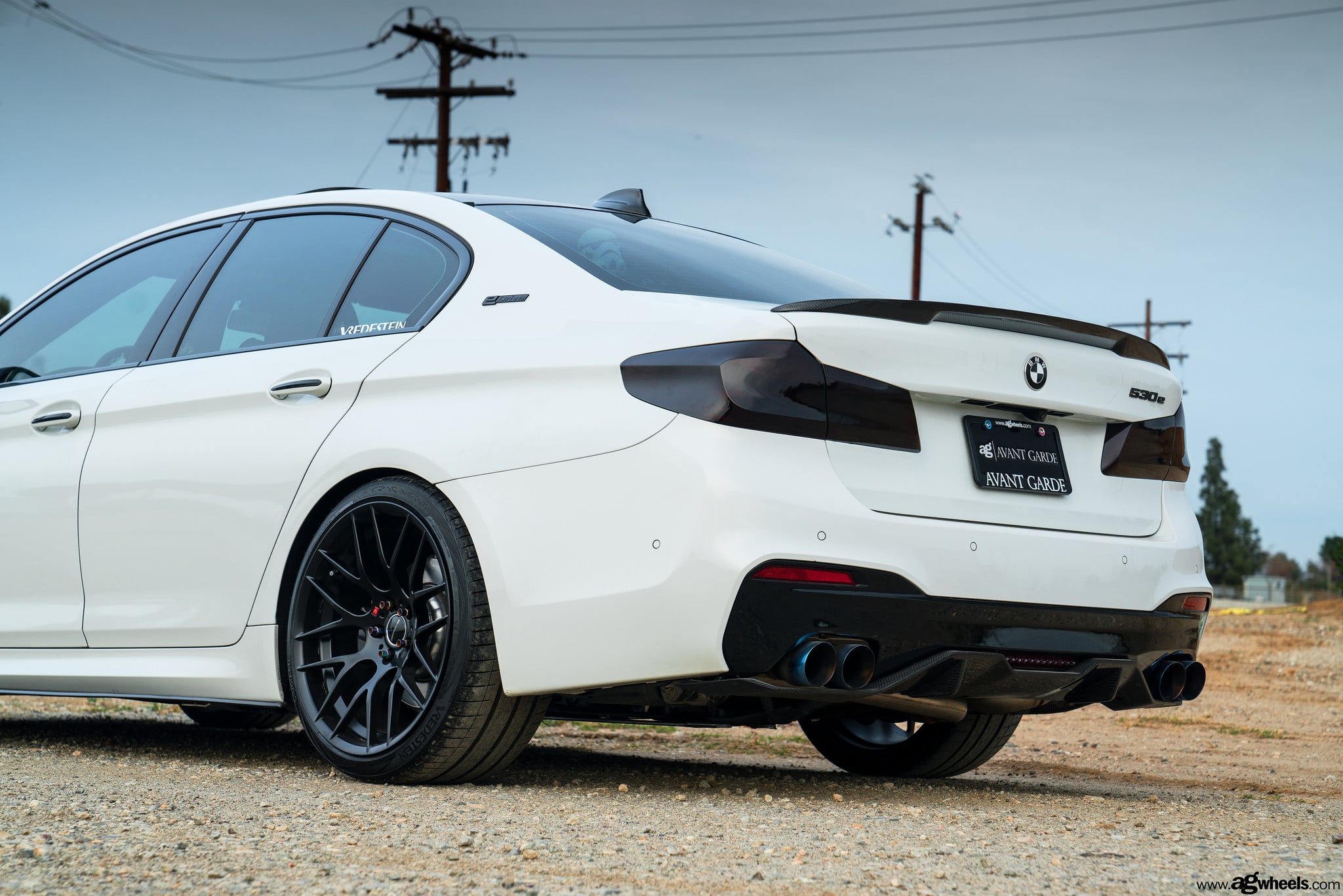 Custom Exhaust System on White BMW 5-Series - Photo by Avant Garde Wheels