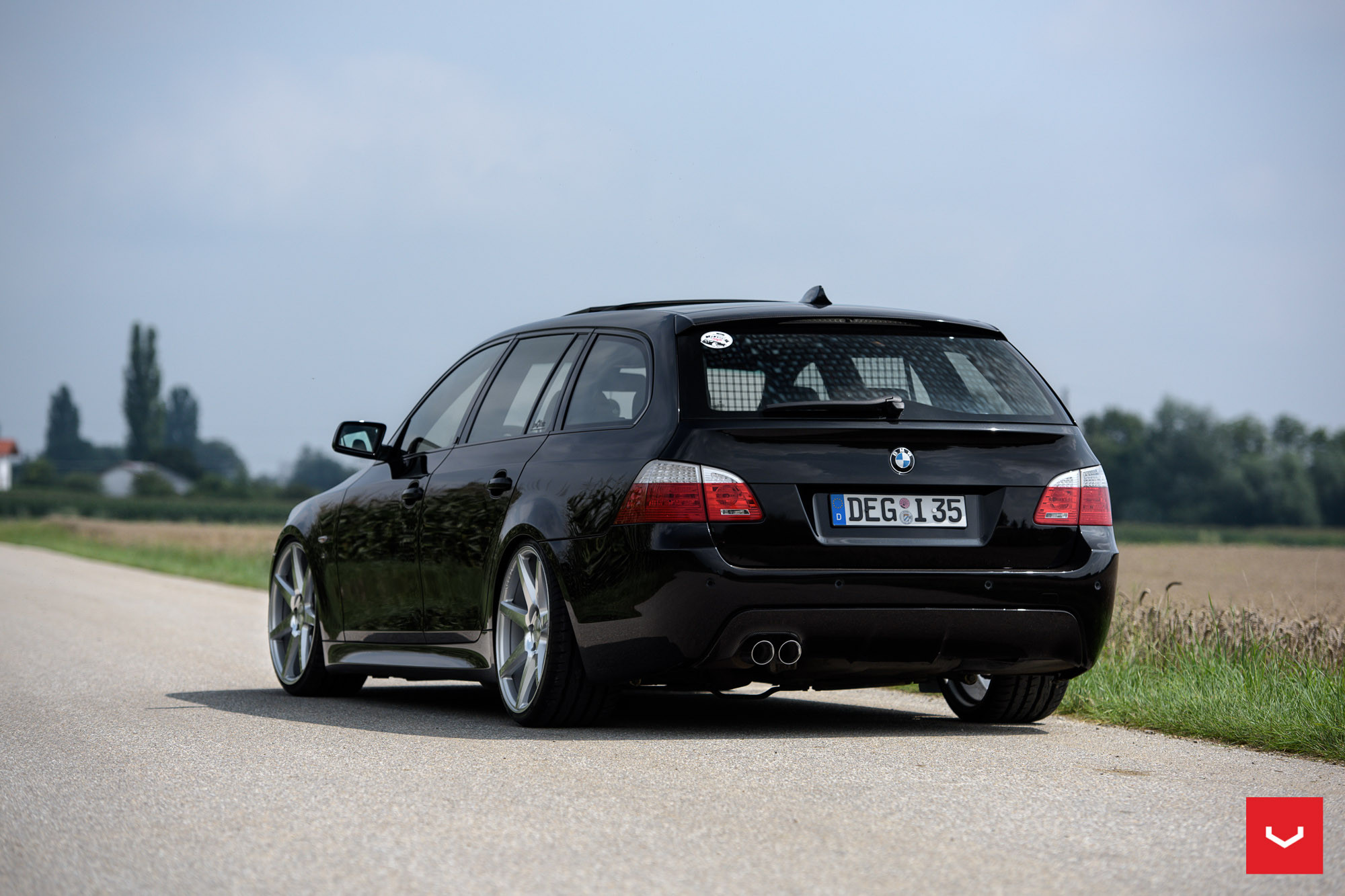 Black BMW 5-Series with Custom Roofline Spoiler - Photo by Vossen