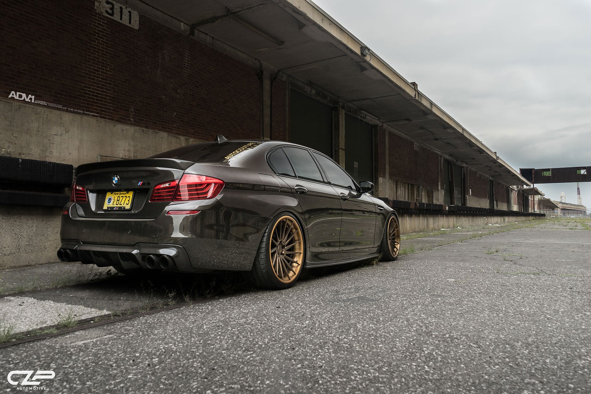 Gray BMW 5-Series with Rear Lip Spoiler - Photo by ADV.1