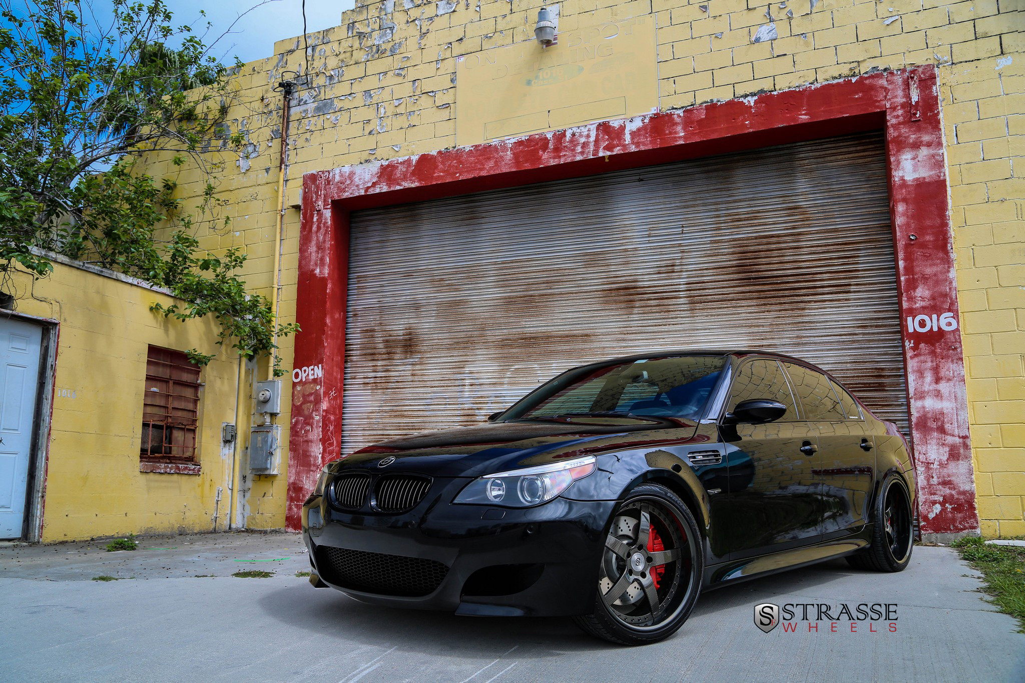 Black BMW 5-Series with Aftermarket Front Bumper - Photo by Strasse Forged
