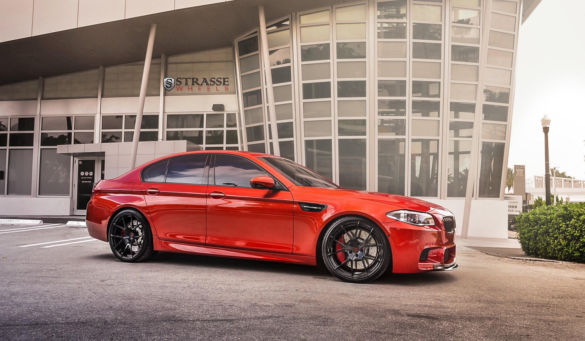 Red BMW 5-Series with Aftermarket Side Skirts - Photo by Strasse Forged