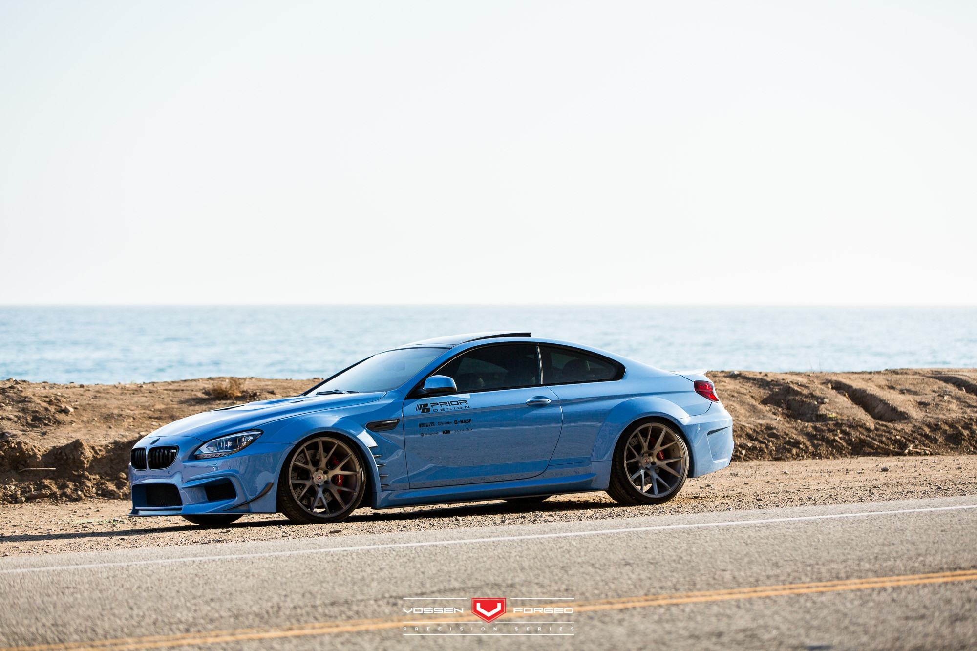 Blue Debadged BMW 6-Series with Custom Fenders - Photo by Vossen