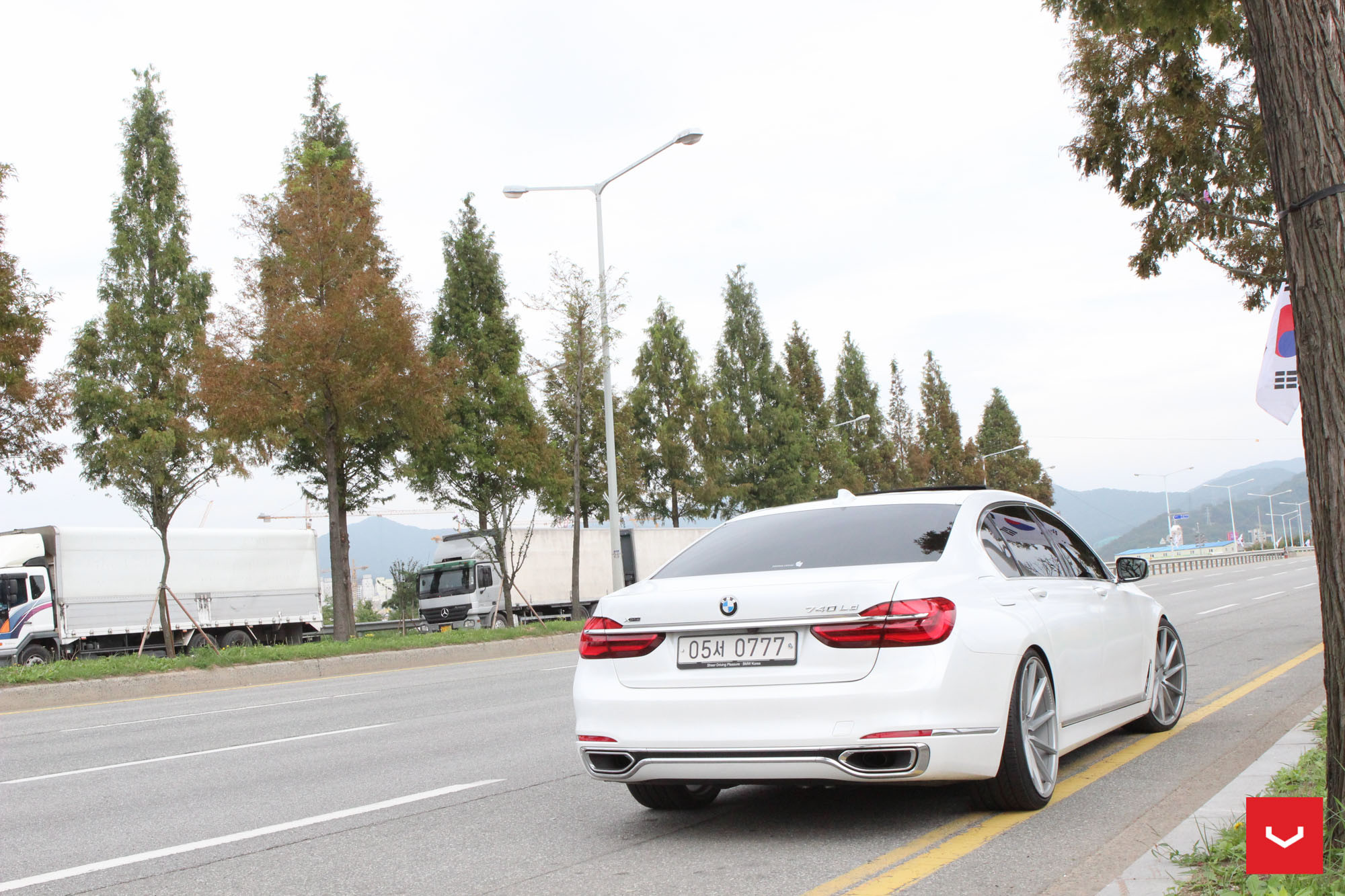 White BMW 7-Series with Aftermarket Rear Bumper Cover - Photo by Vossen
