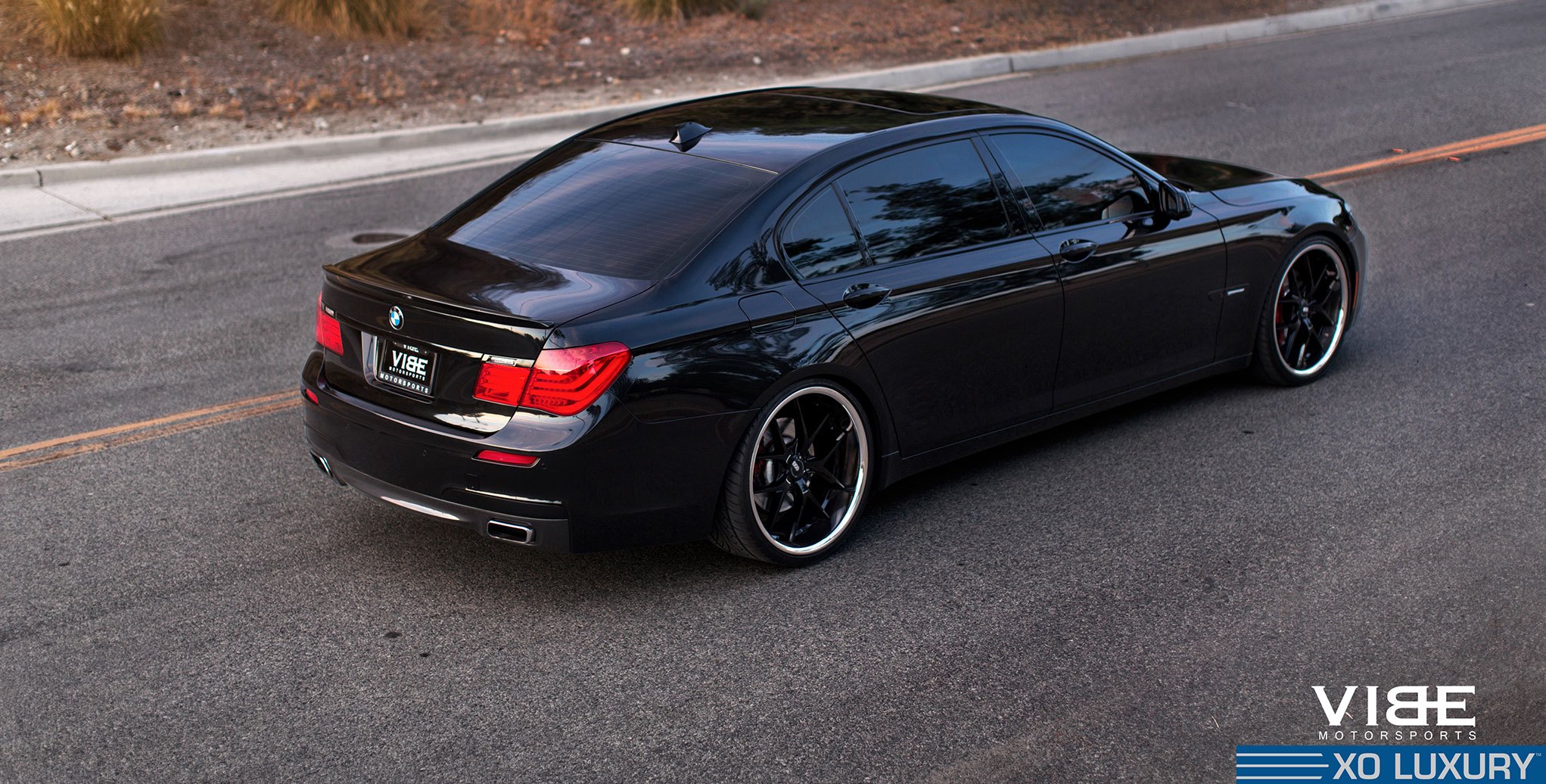 A Touch of Luxury: Blacked Out BMW 7-Series with Aftermarket Parts |  CARiD.com Gallery, image size:2043x1036