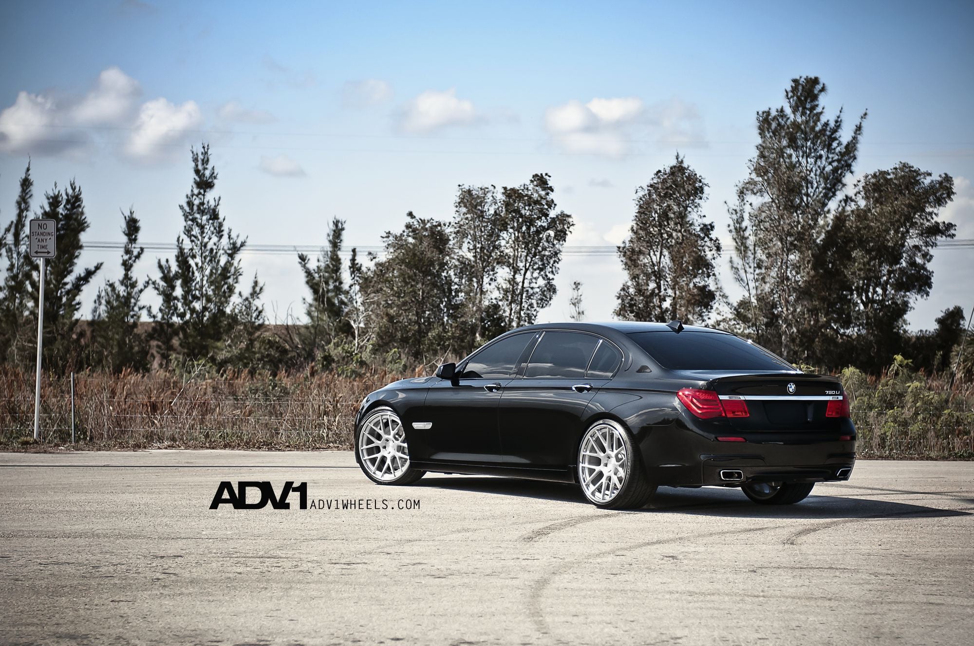 Aftermarket Rear Diffuser on Gloss Black BMW 7-Series - Photo by ADV.1