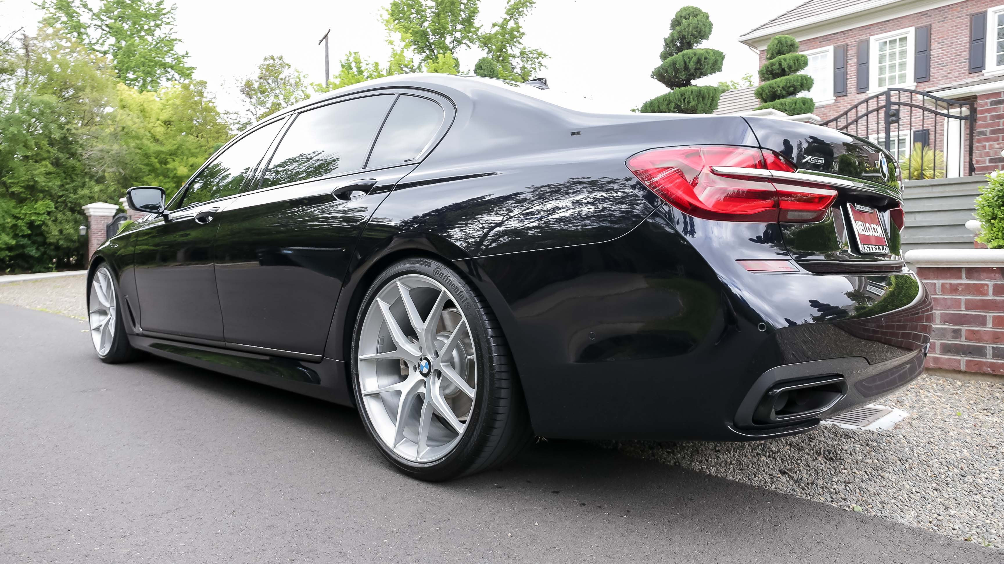 Custom Black BMW 7-Series with Continental Tires - Photo by Forgeline Motorsports