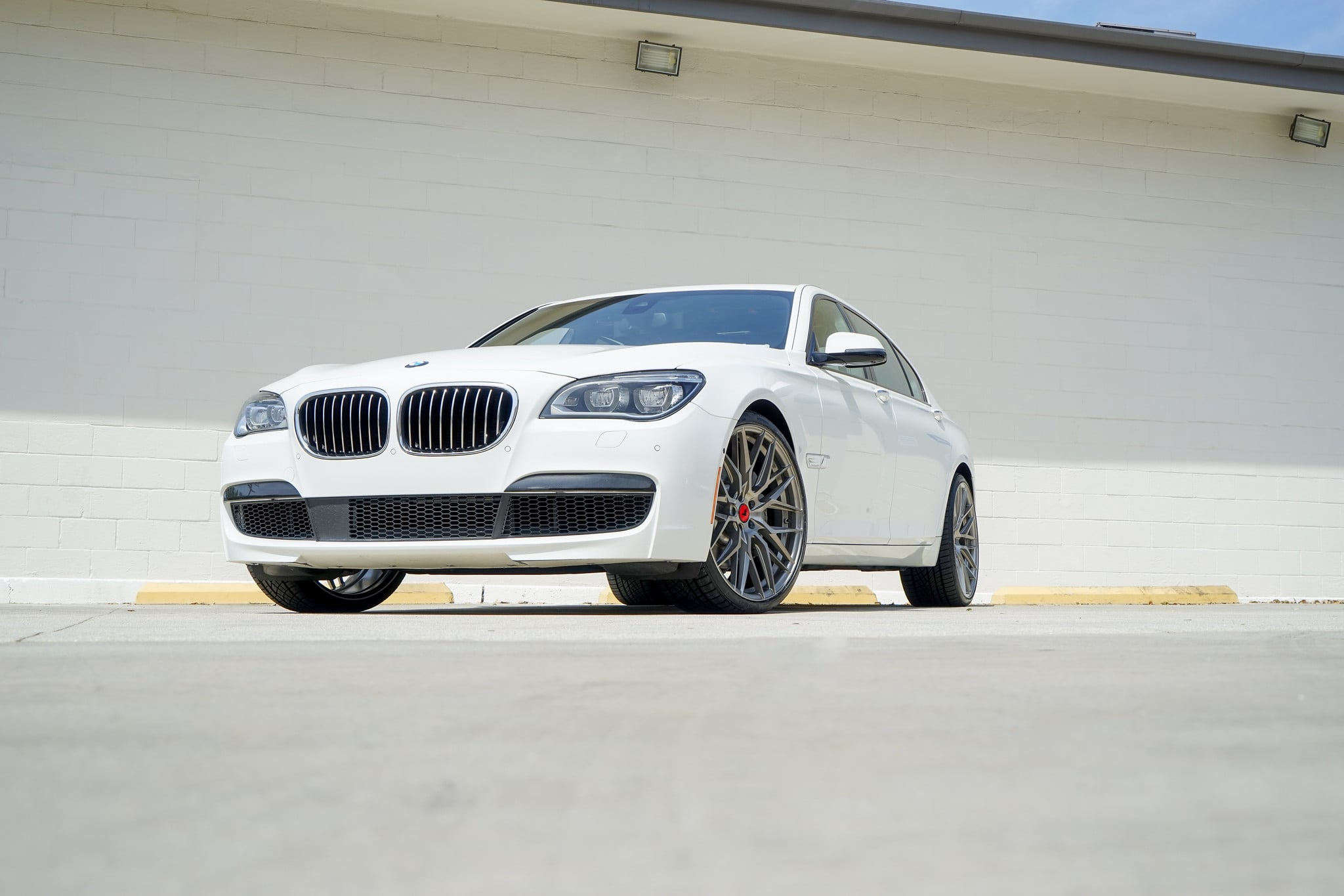 Dark Smoke Headlights on White BMW 7-Series - Photo by Vorsteiner